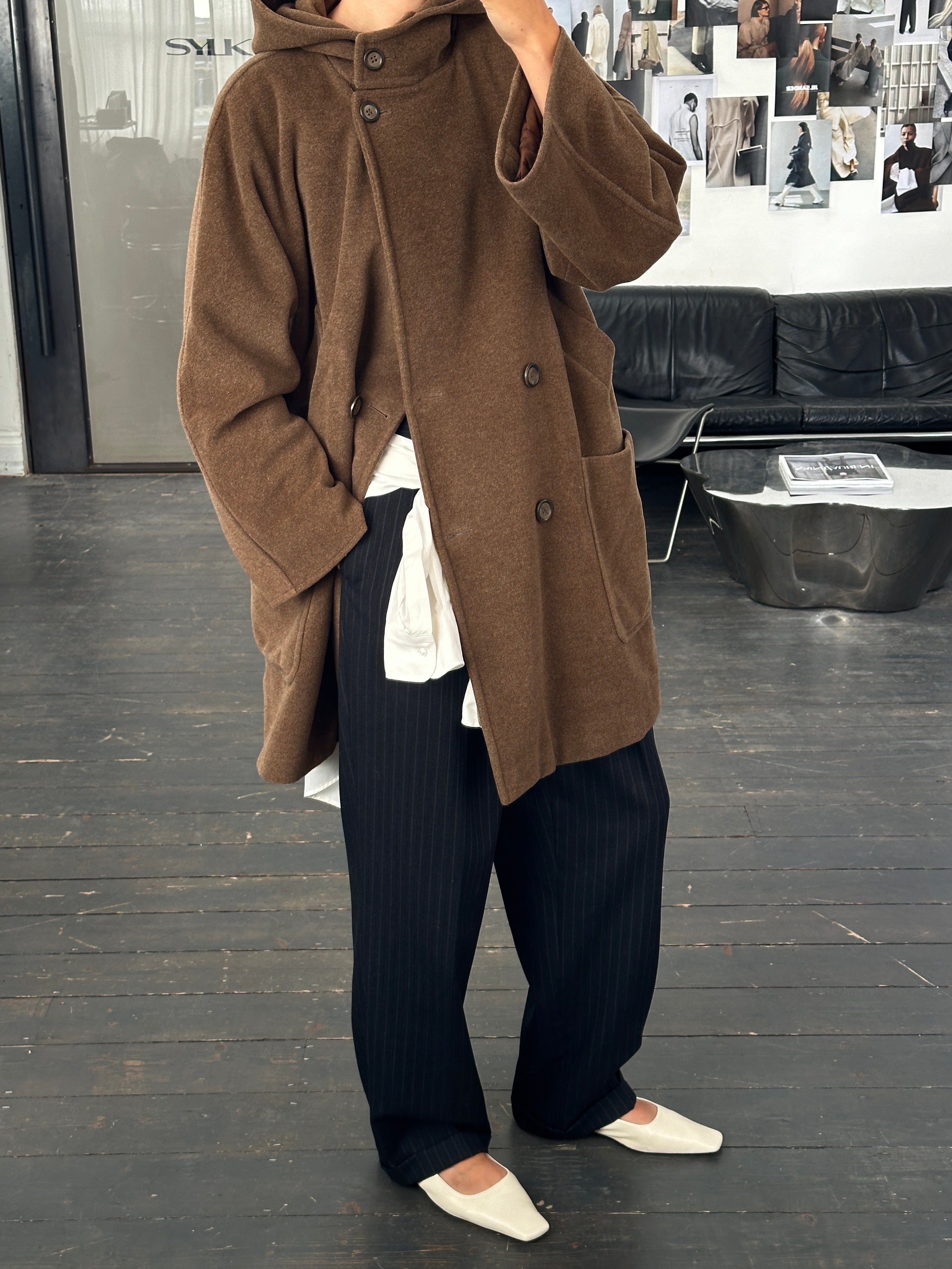 Max Mara Weekend 2000s wool hooded double-breasted coat displayed on a mannequin, featuring a classic tailored design with a hood.