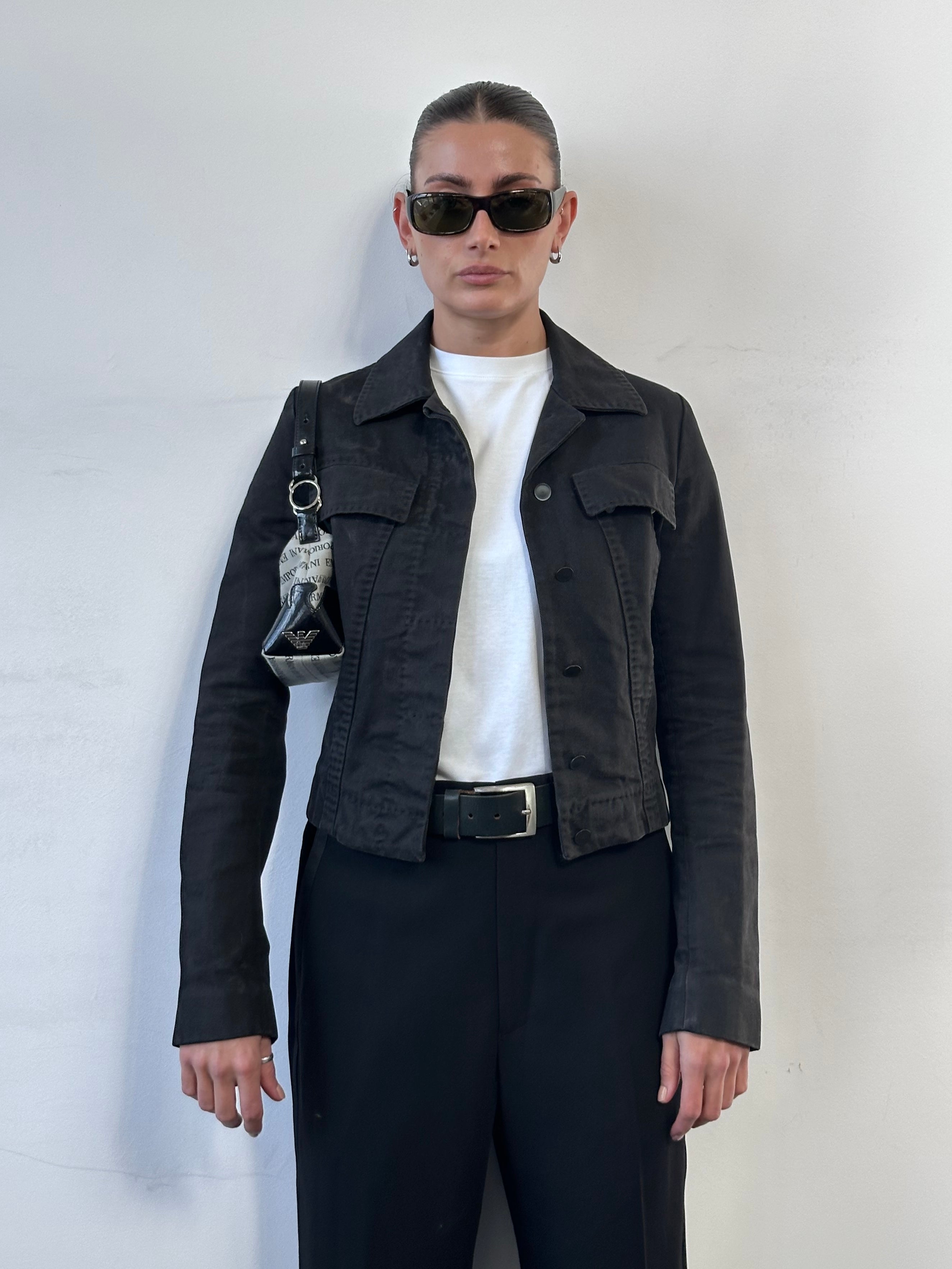 Gucci by Tom Ford 2002 fitted denim jacket in XS, shown on model with classic blue denim and tailored fit.