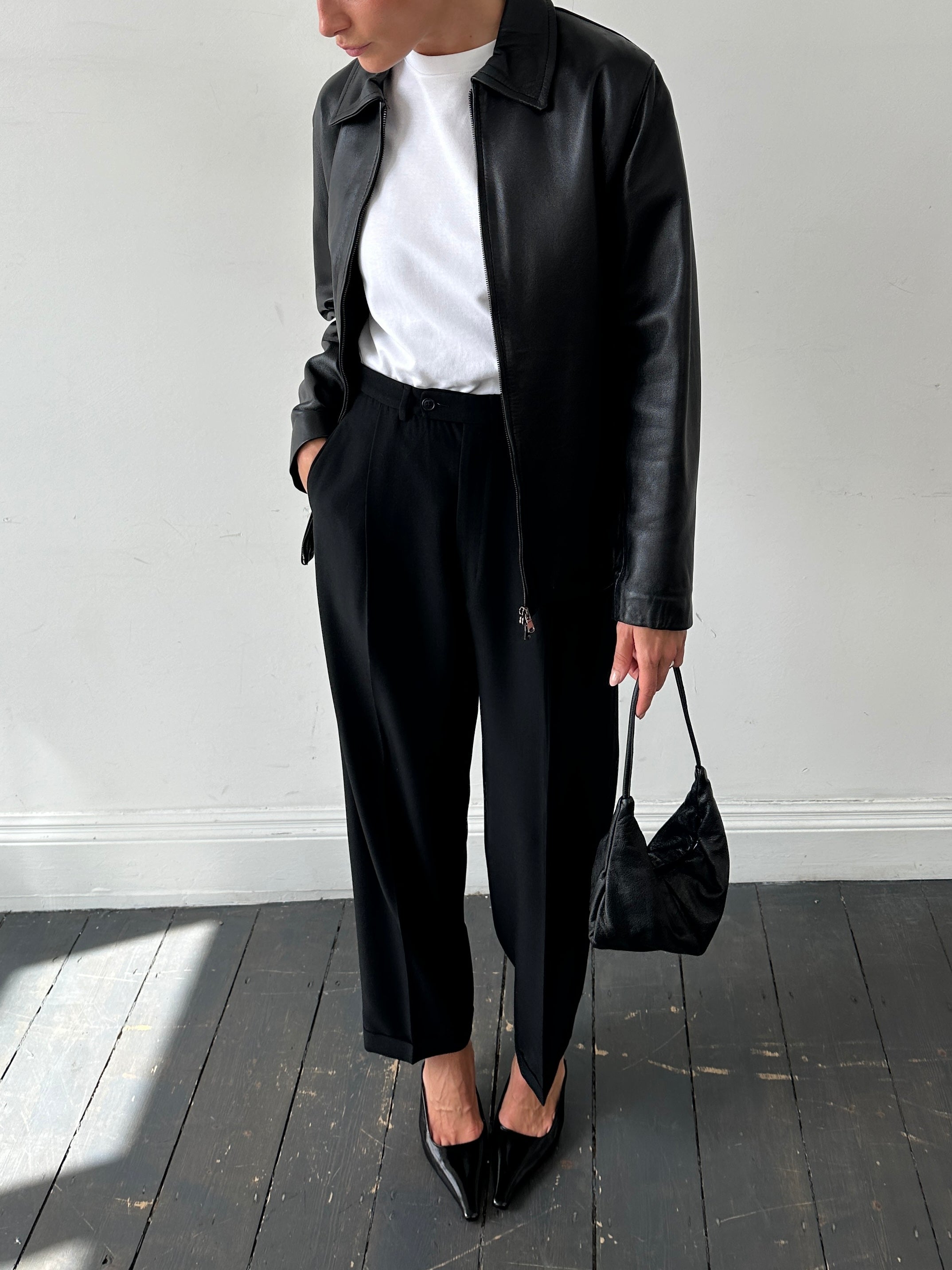 Vintage Italian vintage smooth leather double zip jacket in size M, featuring classic design and sleek black leather.