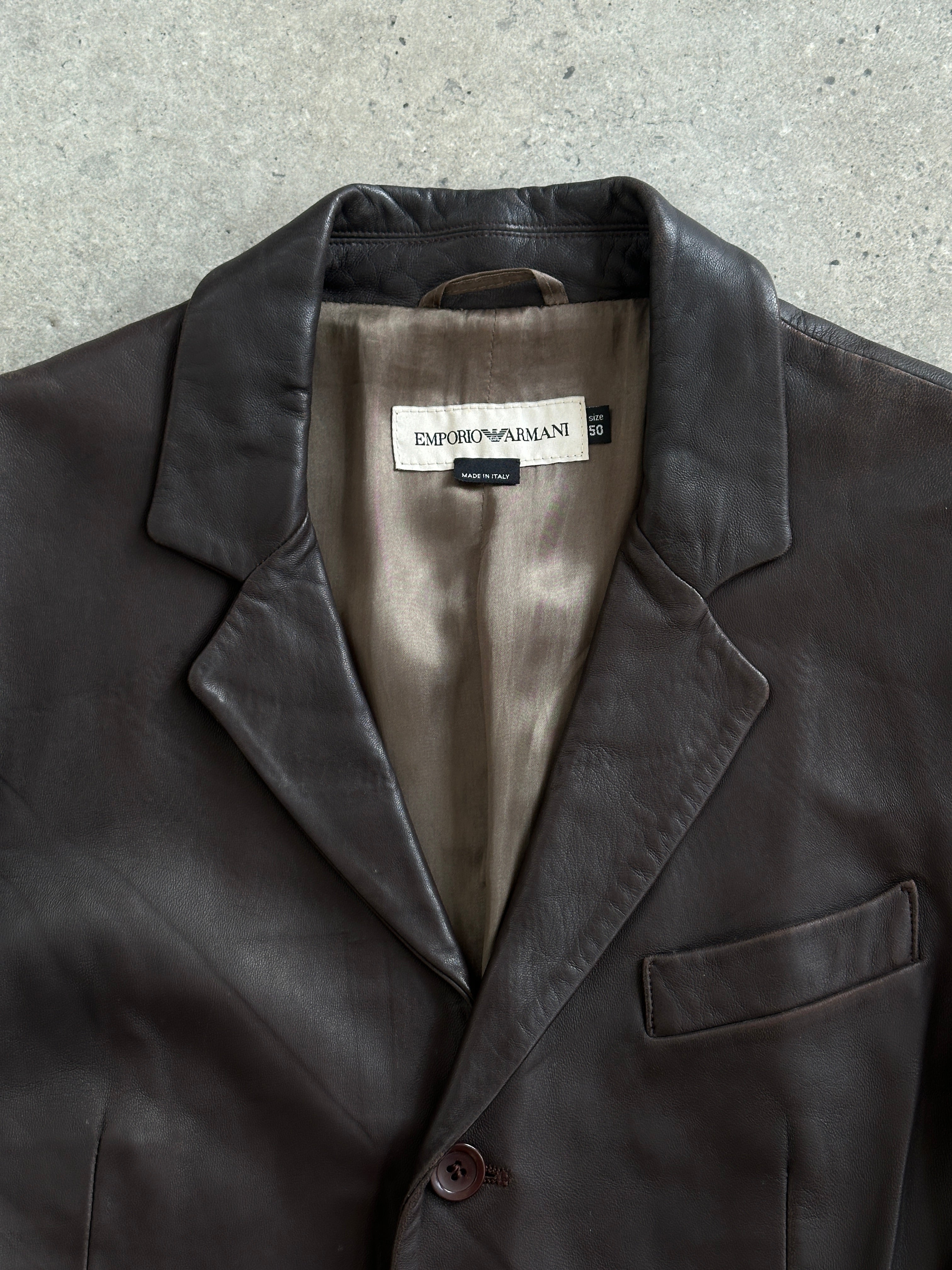 Emporio Armani 1990s lamb leather jacket in black, featuring a classic design with sleek leather finish and stylish collar.