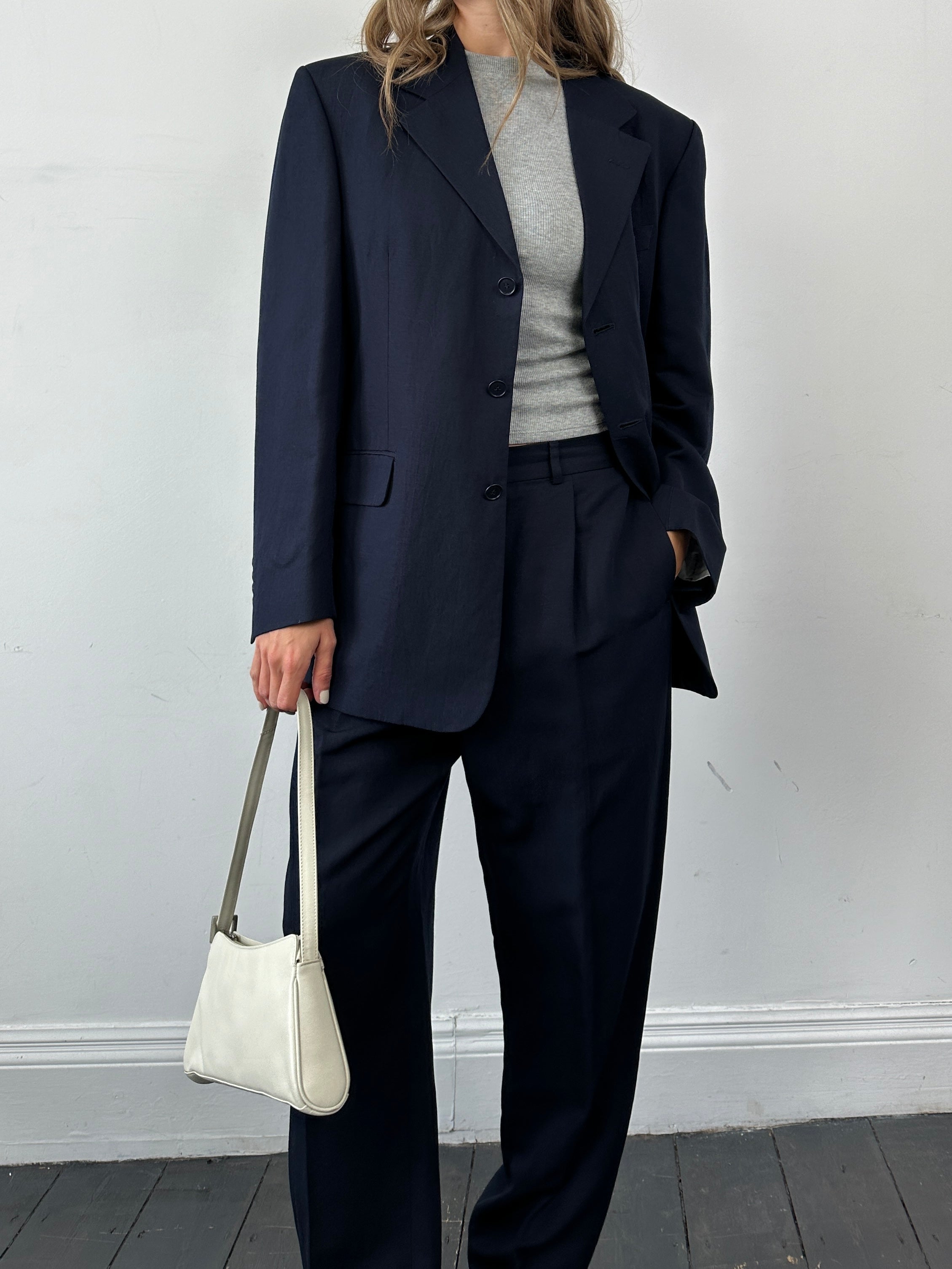Yves Saint Laurent Pour Homme linen silk single-breasted suit jumpsuit in size 42R/W34, shown on a hanger with detailed fabric.
