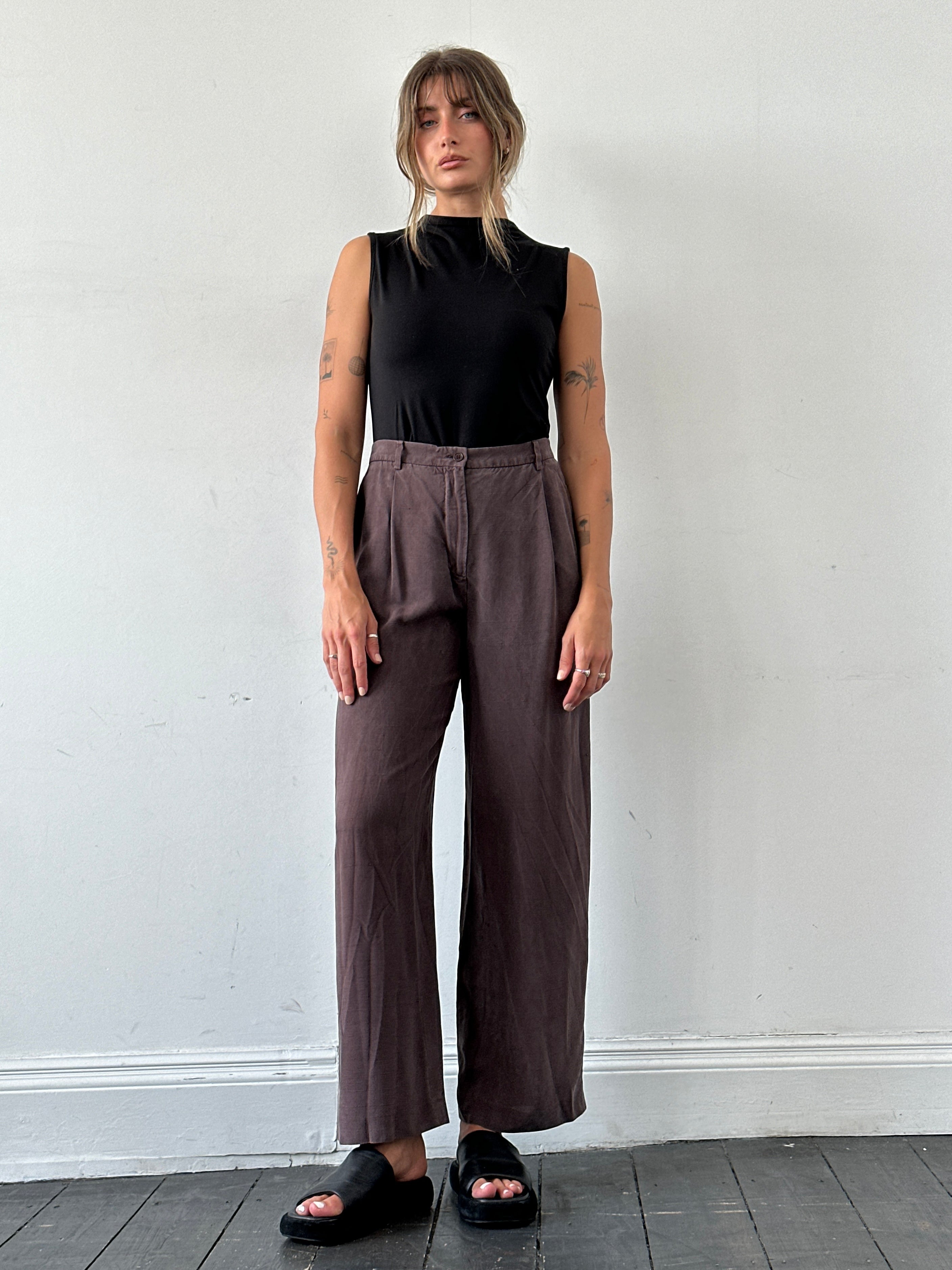 Max Mara pure silk wide-leg high-waisted trousers in W28, showcased with a smooth, flowing fabric and tailored fit.