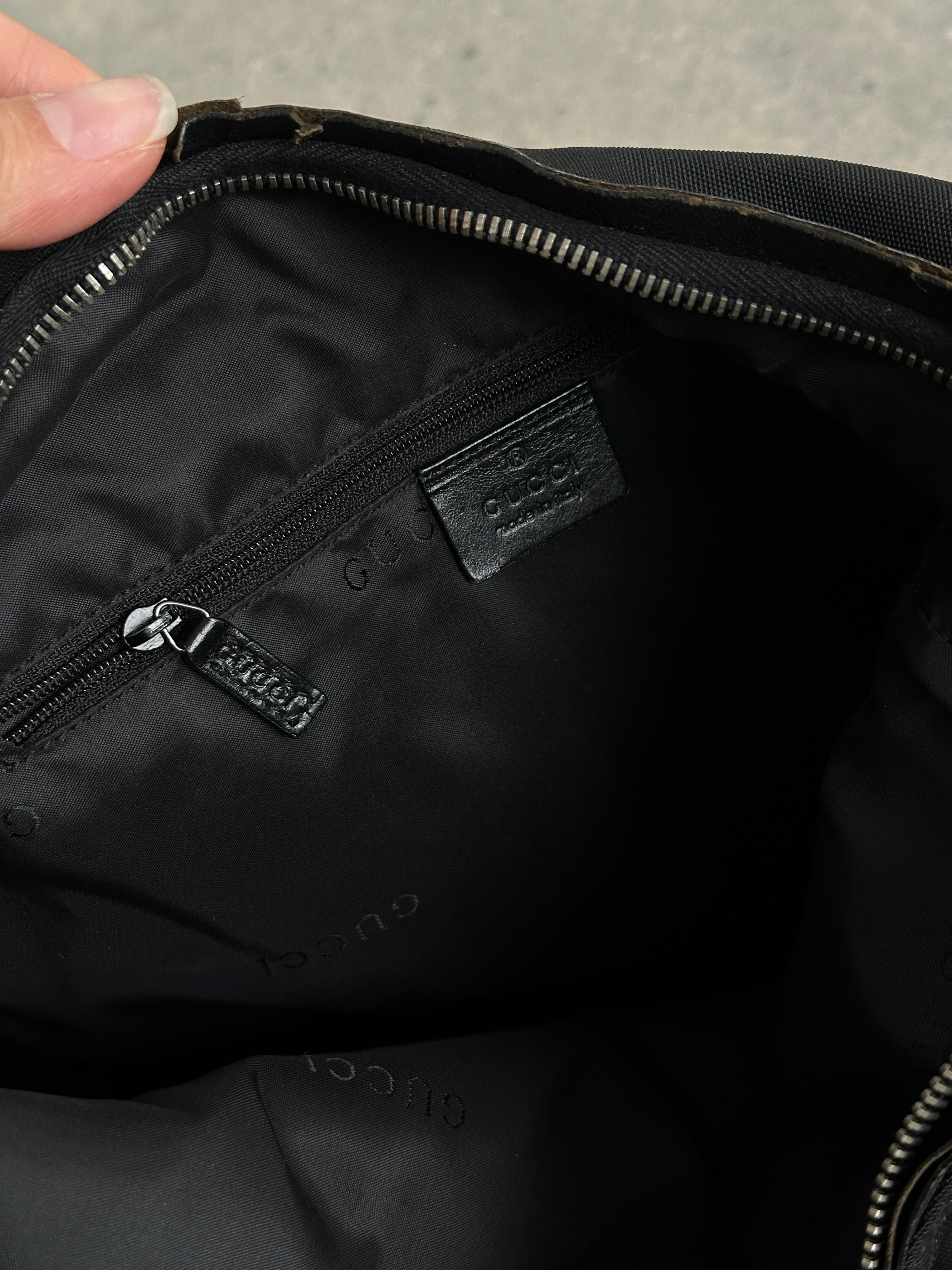 Gucci 1990s Tom Ford canvas and leather hobo shoulder bag with a spacious design and classic style.