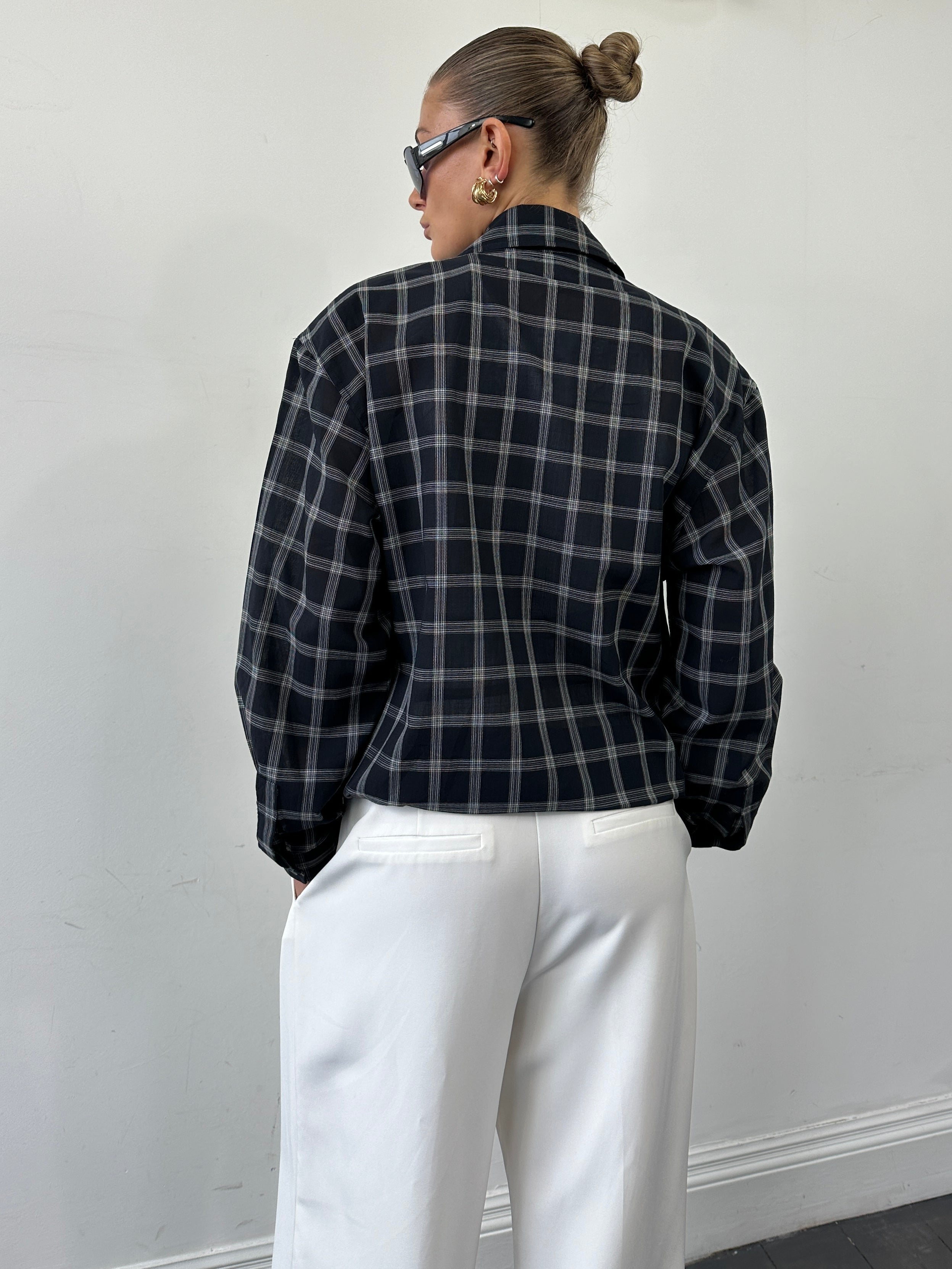 Yves Saint Laurent Pour Homme check logo bomber jacket in black with ribbed cuffs and collar, size M/L, stylish men's outerwear.