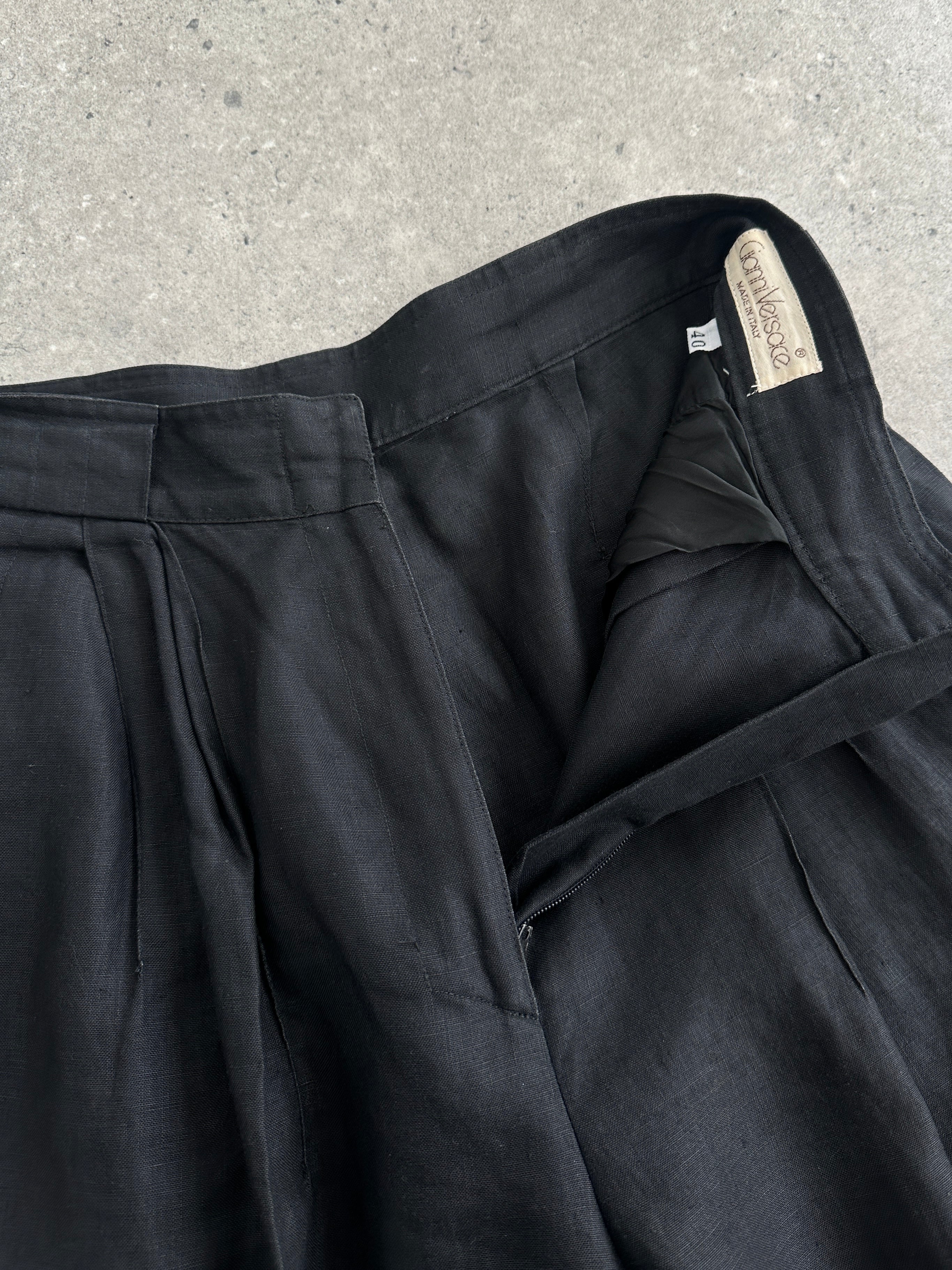 Versace 1980s linen high-waisted trousers in W24, featuring classic design and tailored fit, shown in a high-quality image.