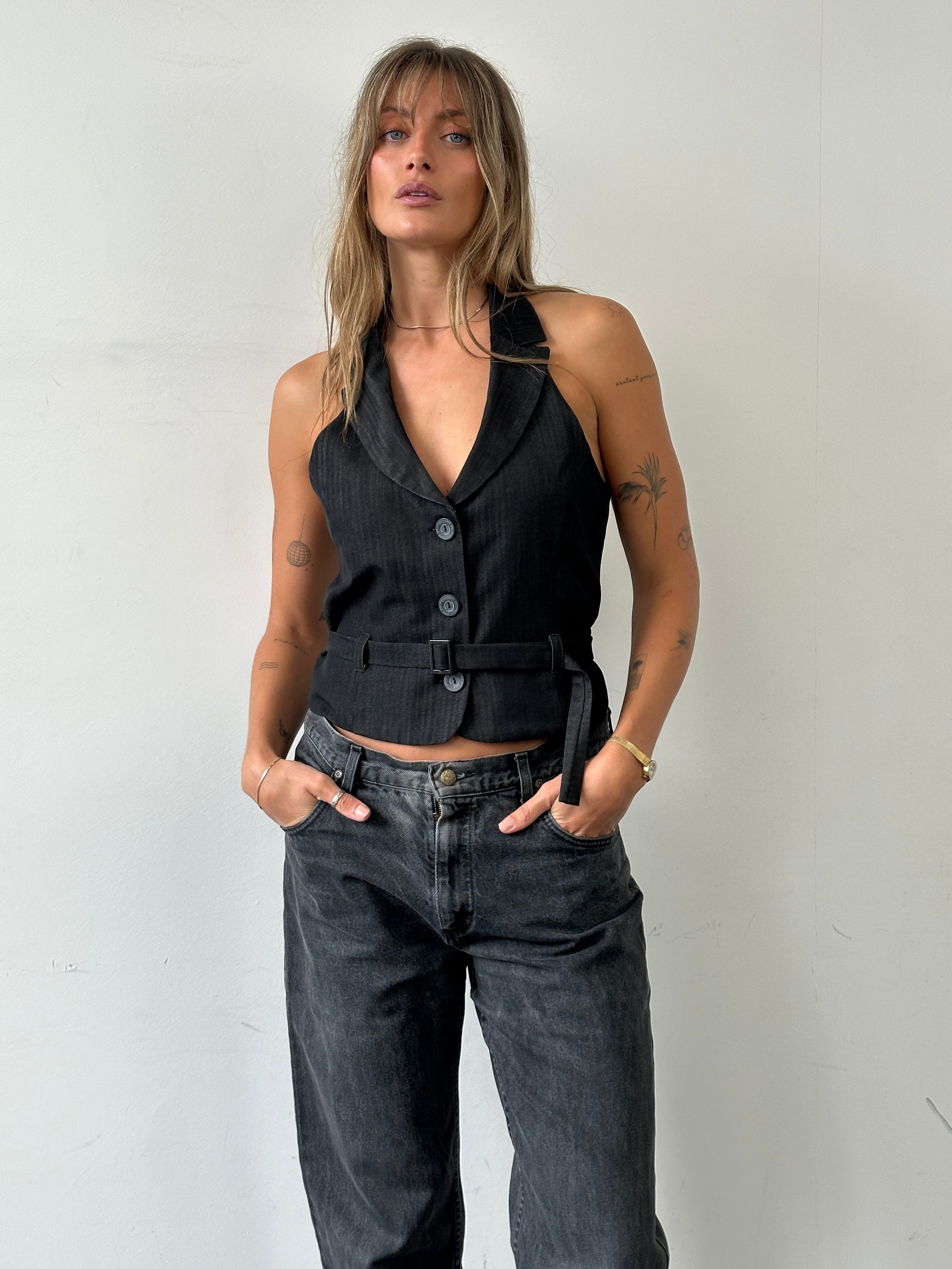 Vintage brand halterneck belted waistcoat in size M, featuring a stylish vintage design with a fitted waist and unique halterneck style.