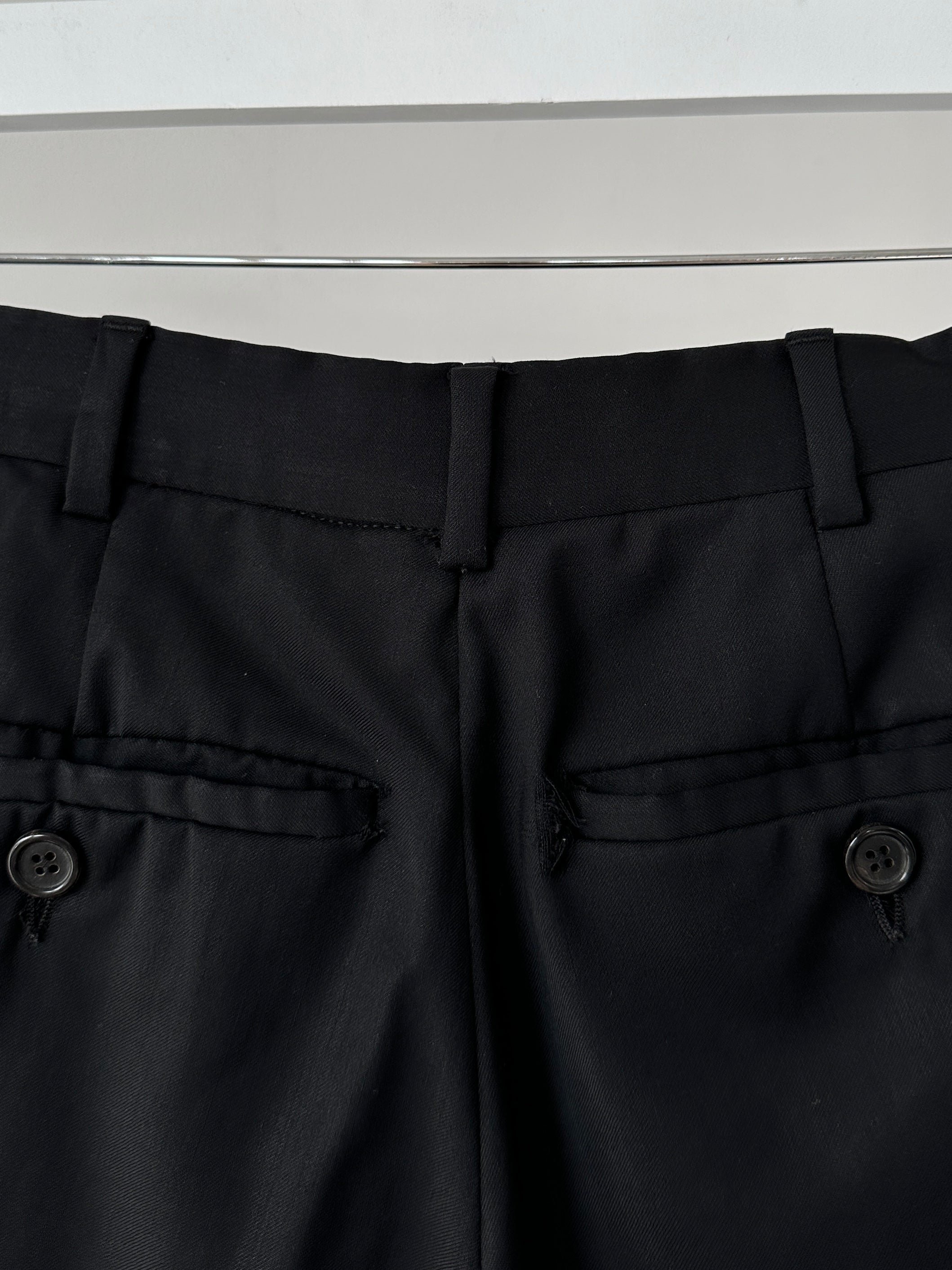 Prada virgin wool jumpsuit with mid-rise, single-breasted design, in size 40L/W28, shown on a hanger.