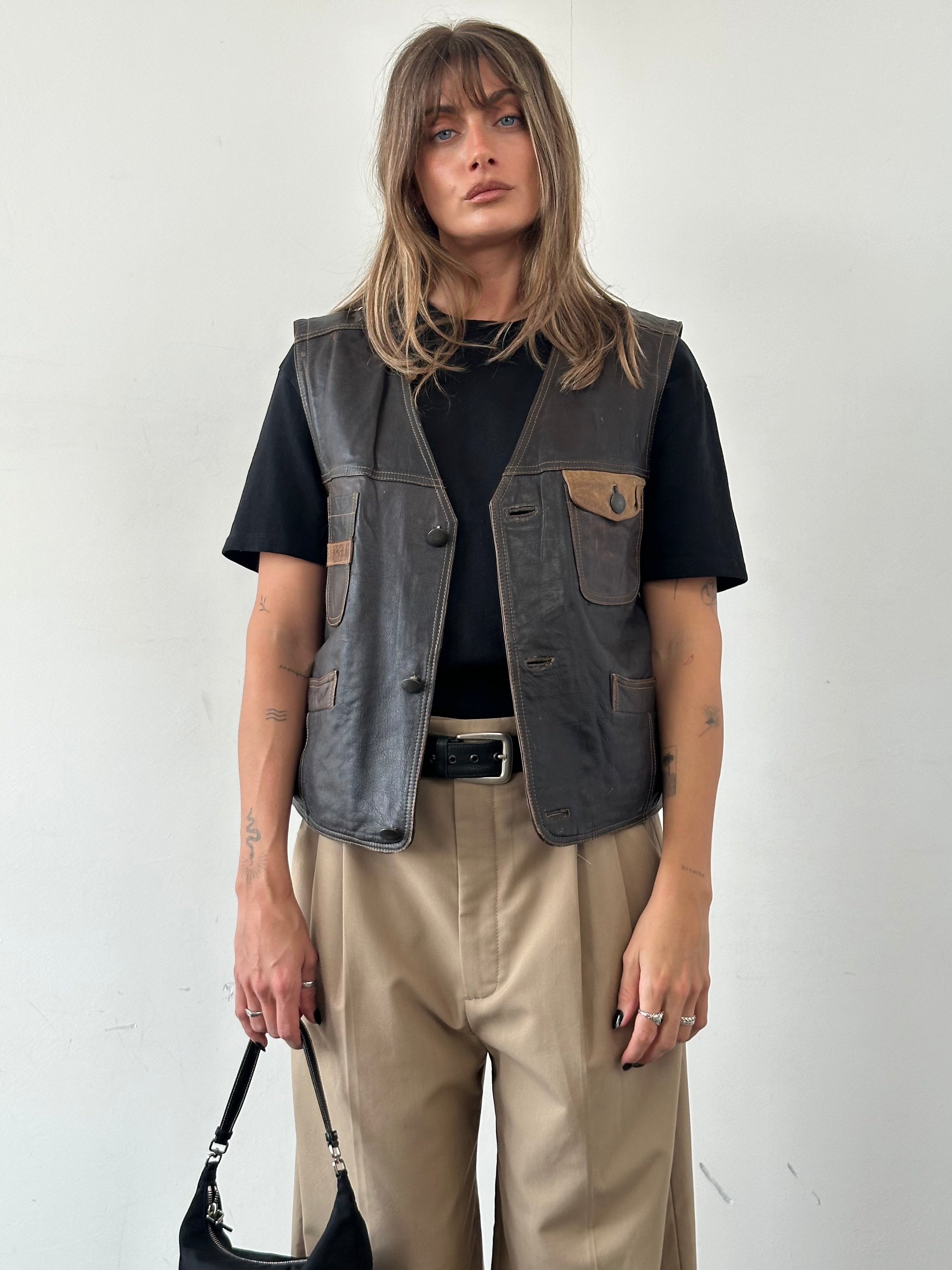 Vintage camel distressed leather waistcoat, size M, featuring worn leather and classic design, front view.