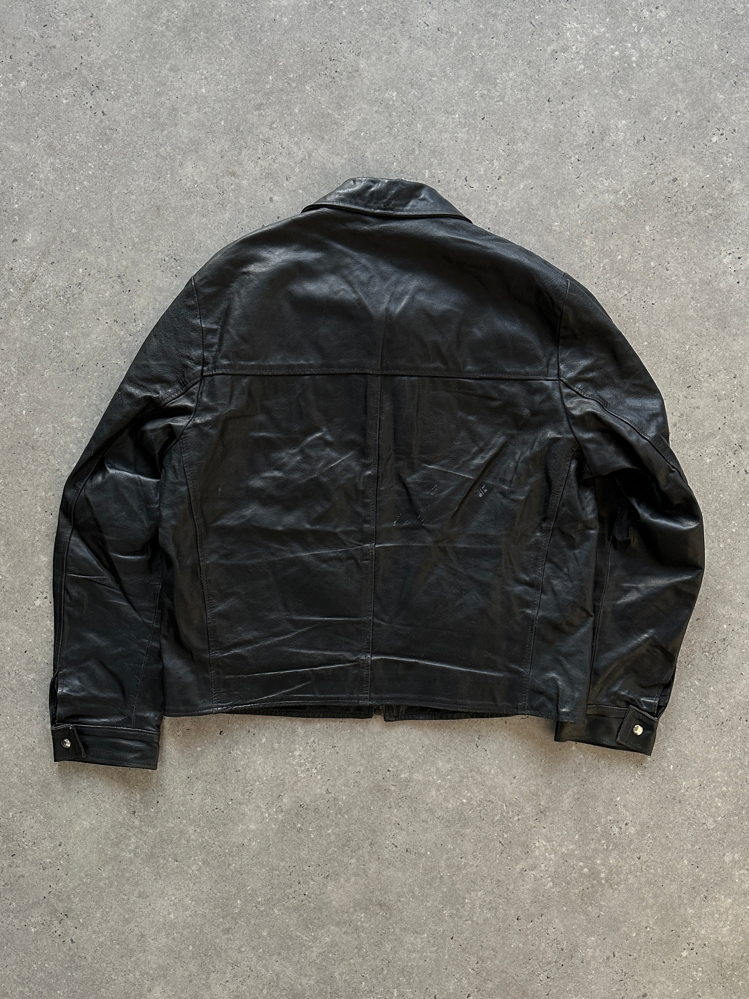 Vintage leather jacket in size large, featuring classic design and textured brown leather, displayed on a hanger.