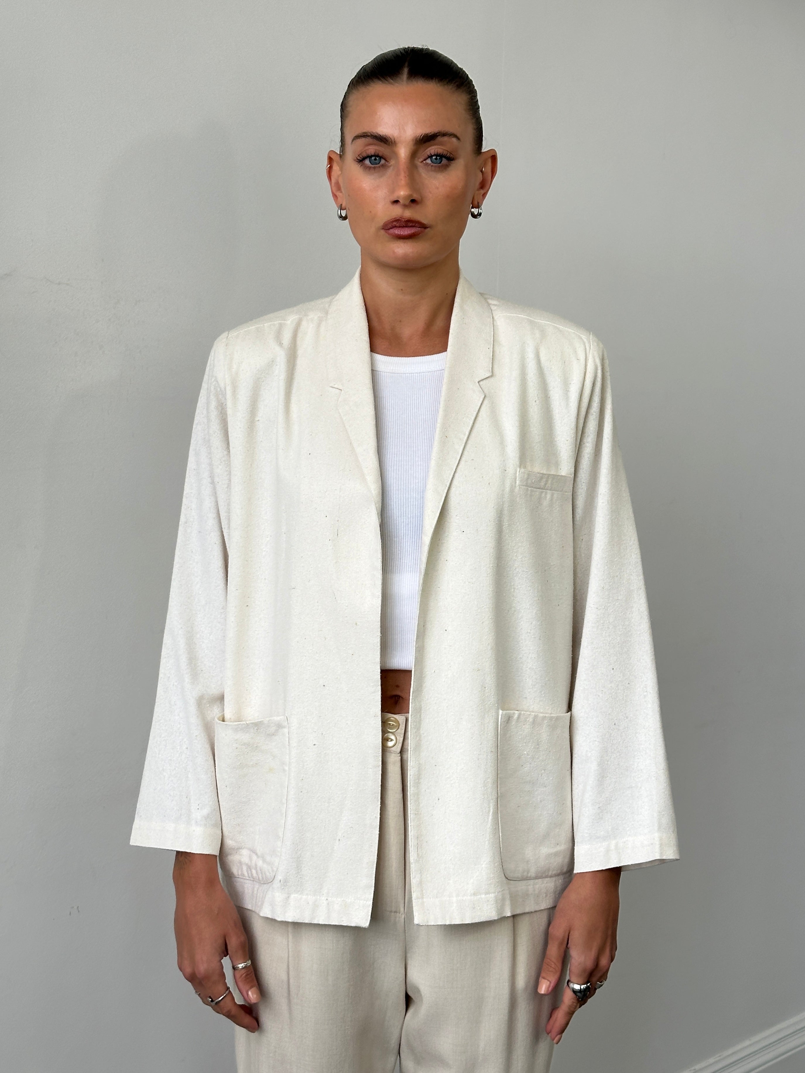 Vintage pure silk minimal blazer in S/M, showcasing sleek design and elegant fit in a classic style.