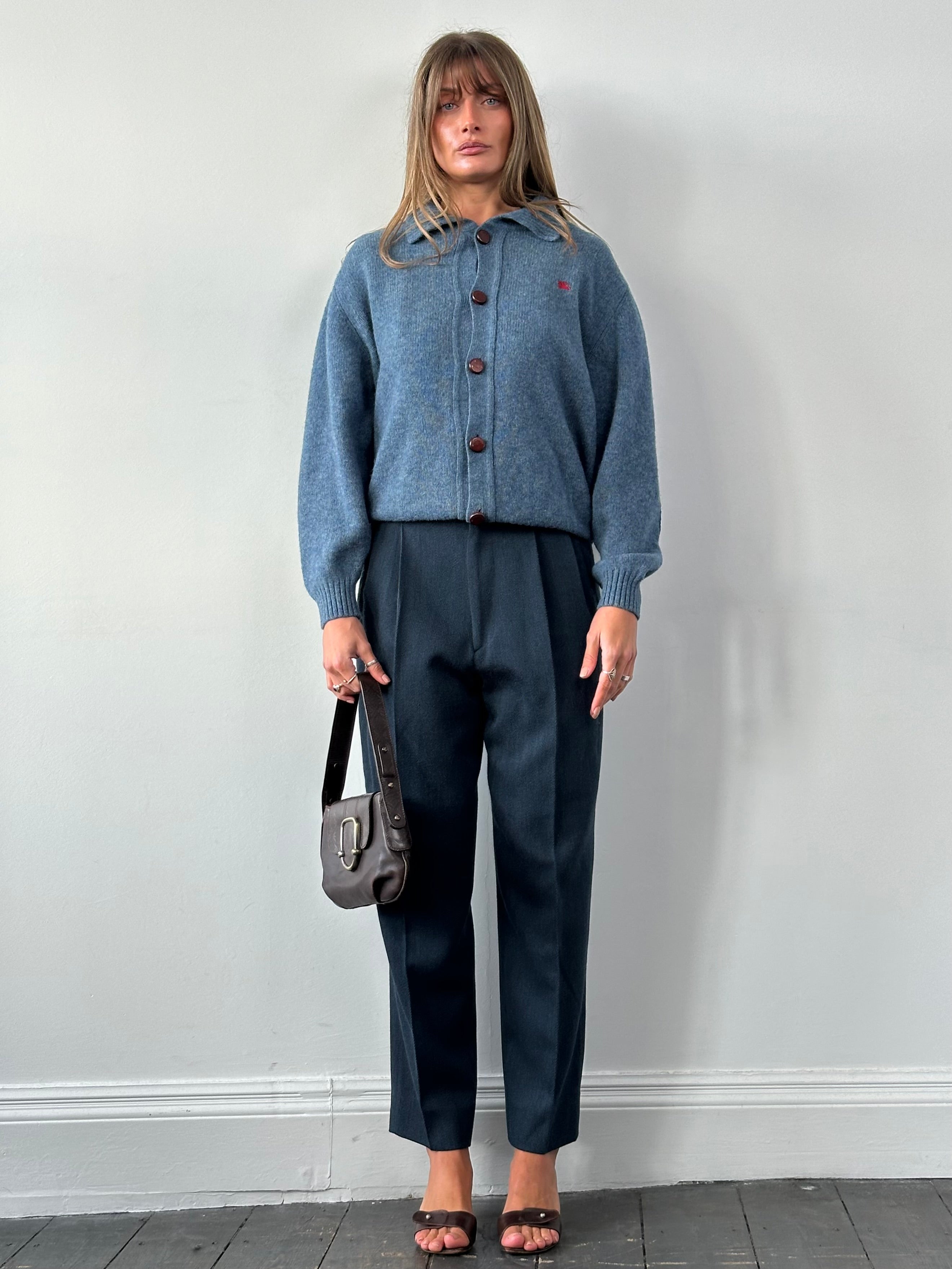 Vintage Italian high-waisted tailored trousers made of pure wool, featuring a classic vintage style in size W28.