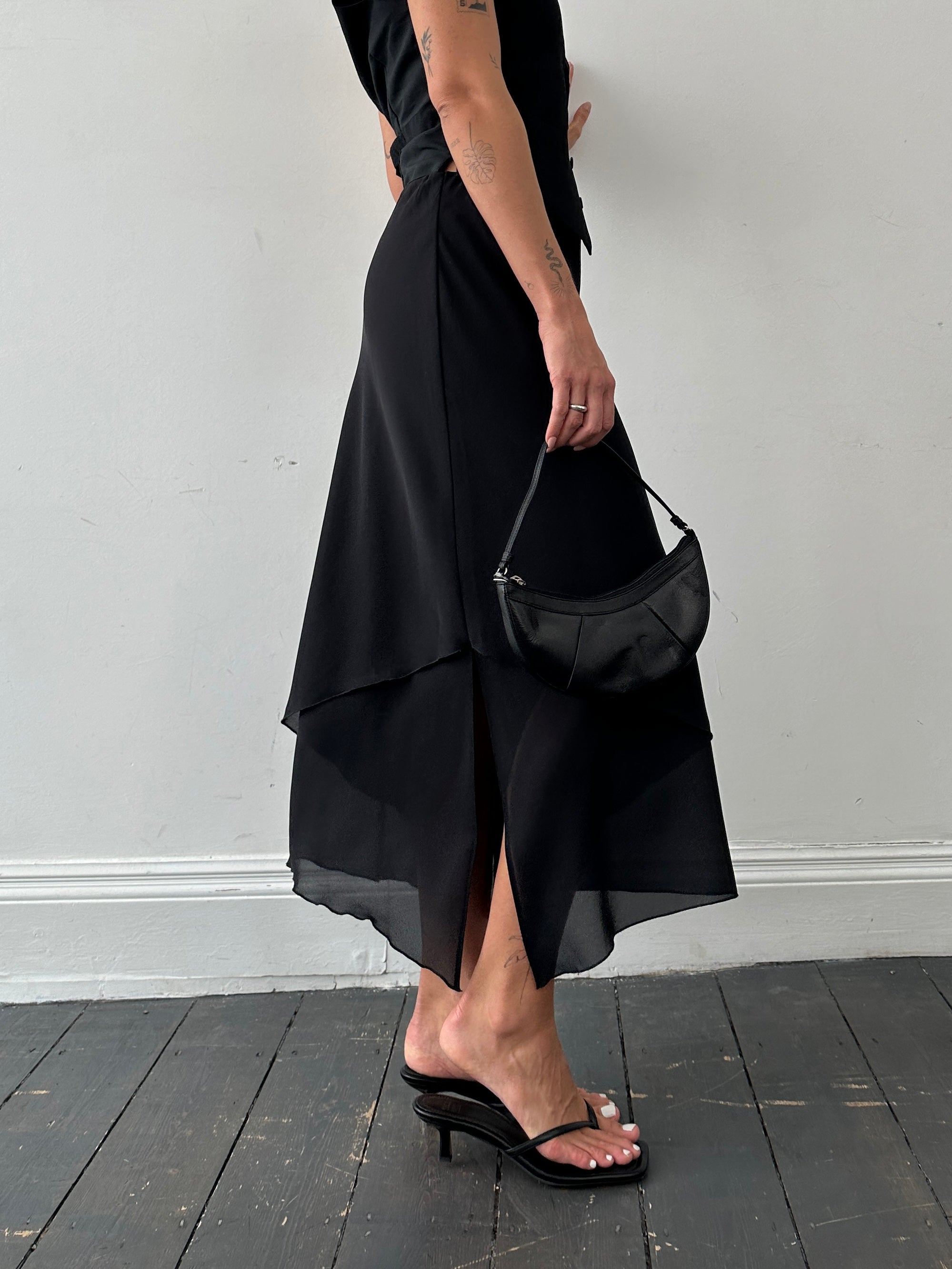 Vintage floaty double-layered midi skirt in soft fabric, designed for a relaxed, flowing fit around the waist and hips.