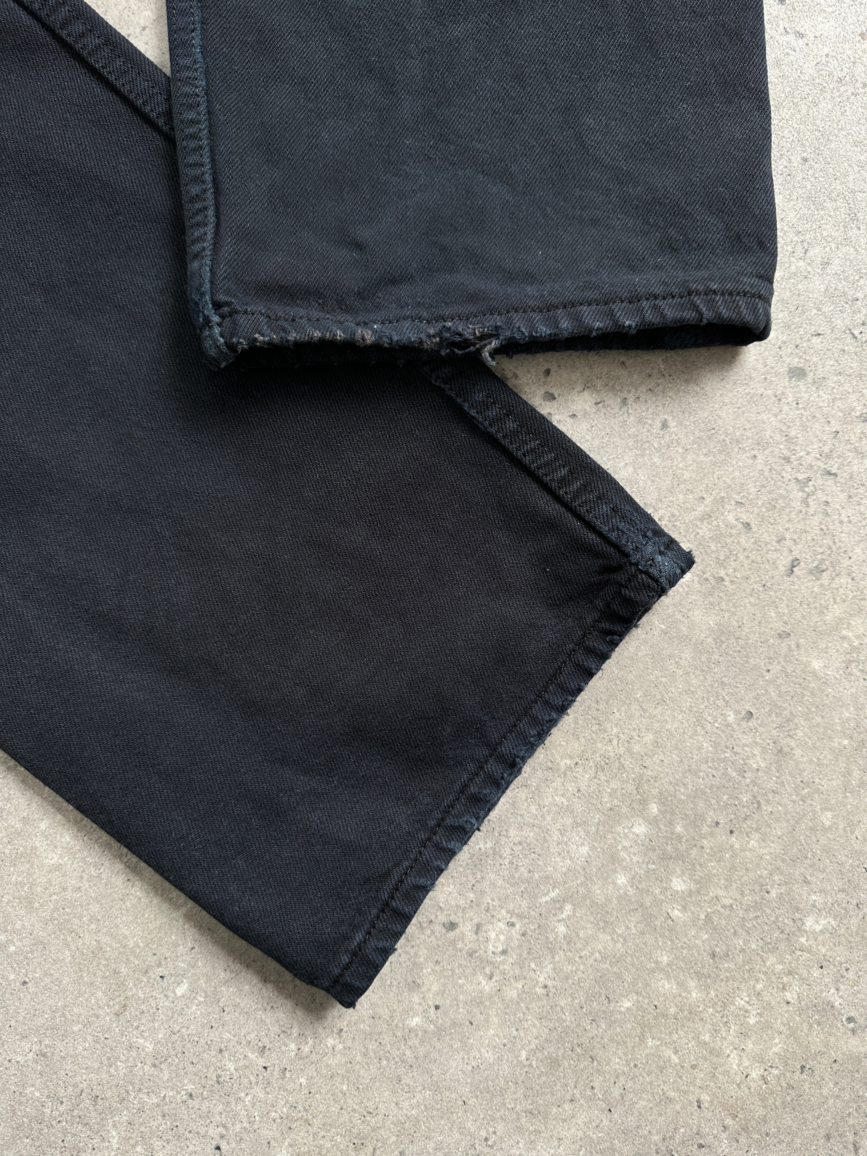 Levi’s 501 straight leg high waisted denim jeans in W32, classic blue wash, displayed on a hanger.
