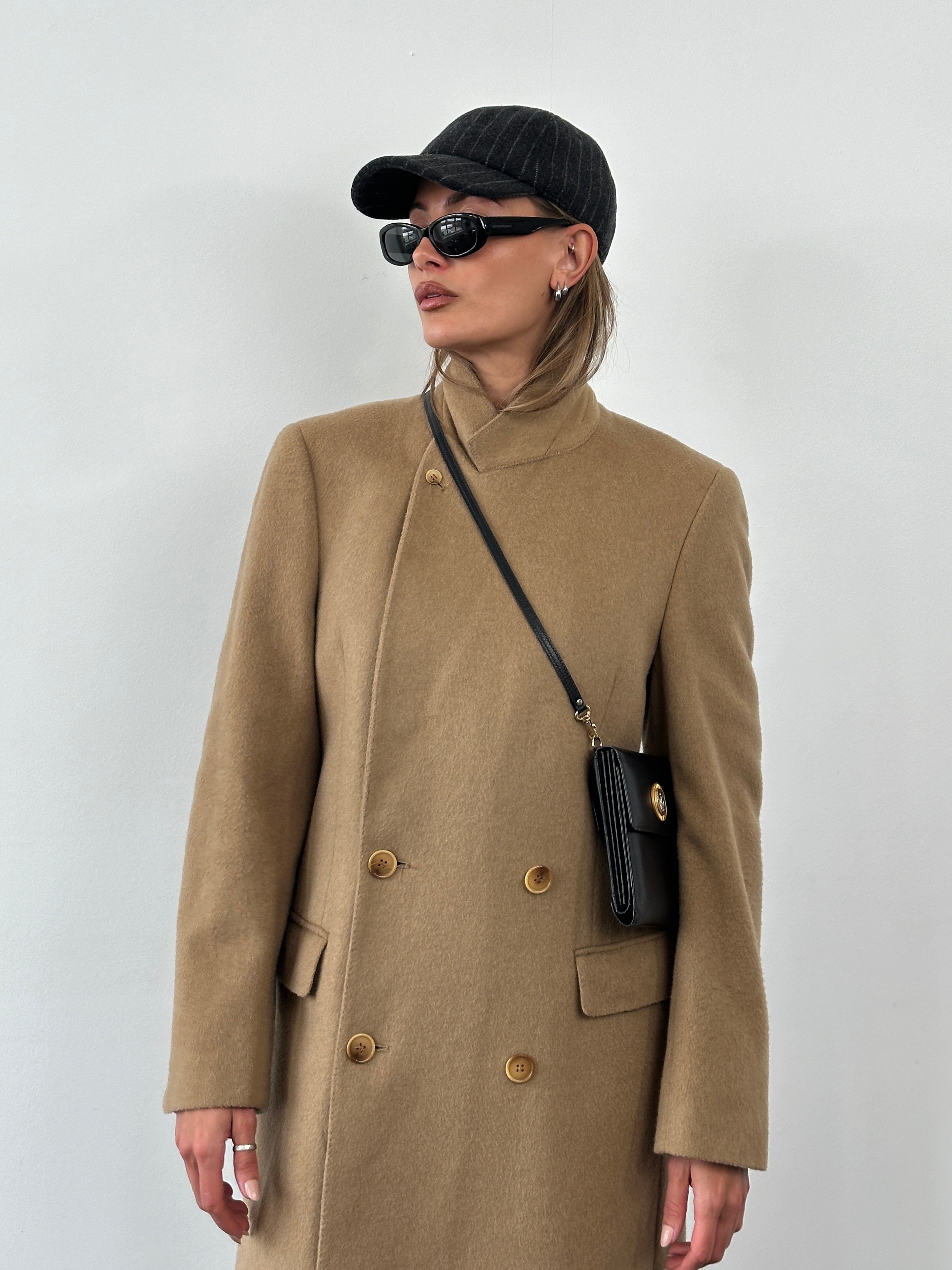 Vintage 1990s wool double-breasted high-neck coat in size large, featuring classic design and textured fabric.