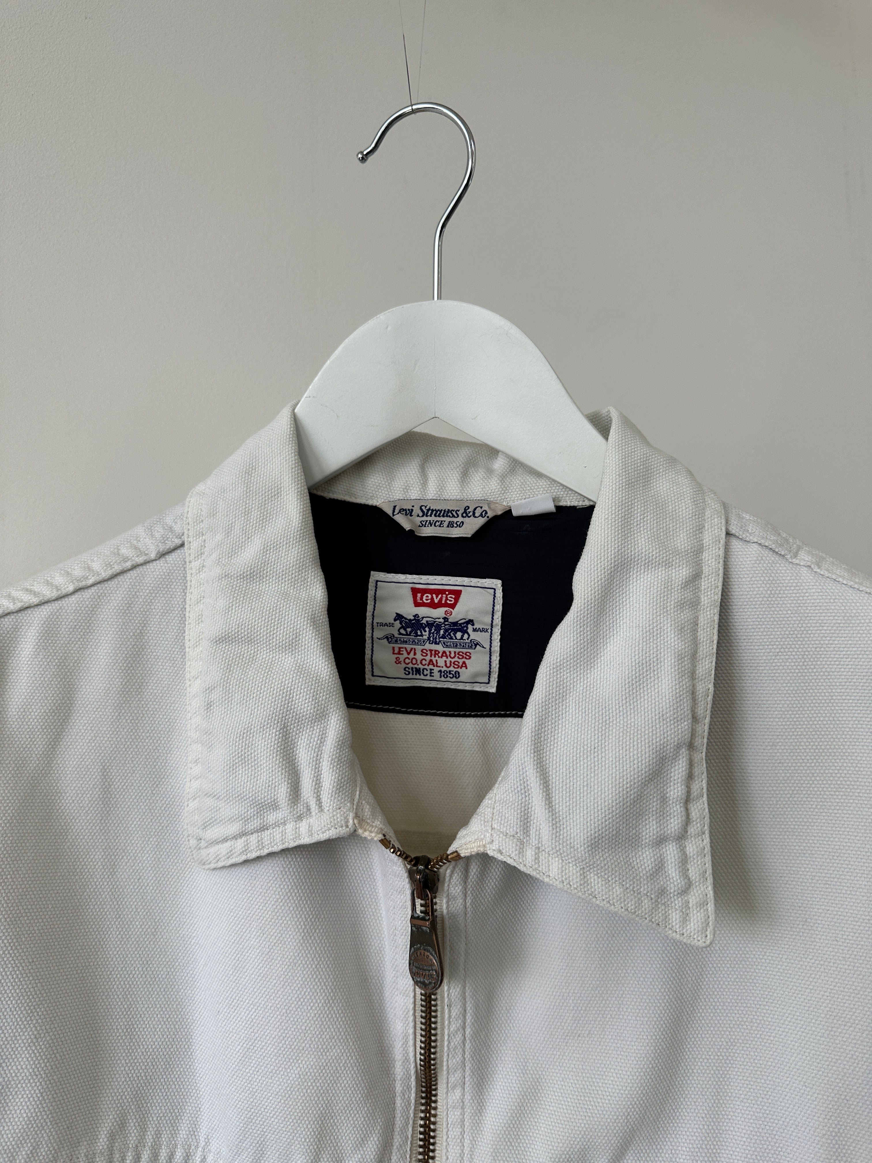 Levi’s cotton zip-up bomber jacket in size L, featuring a classic design with ribbed cuffs and collar, shown on a hanger.