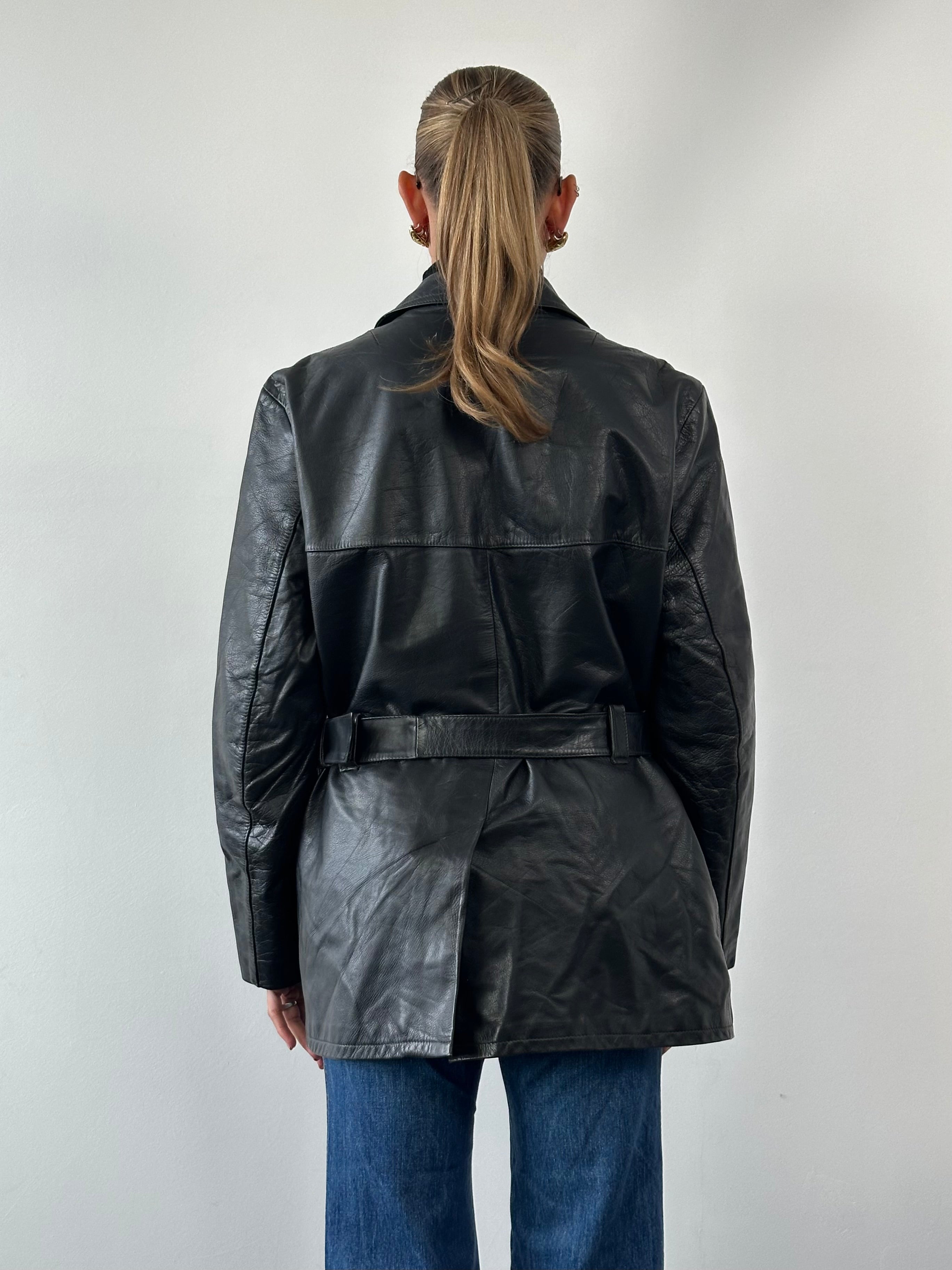 Vintage belted leather jacket in size XL, featuring classic design, high-quality leather, and stylish vintage detailing.