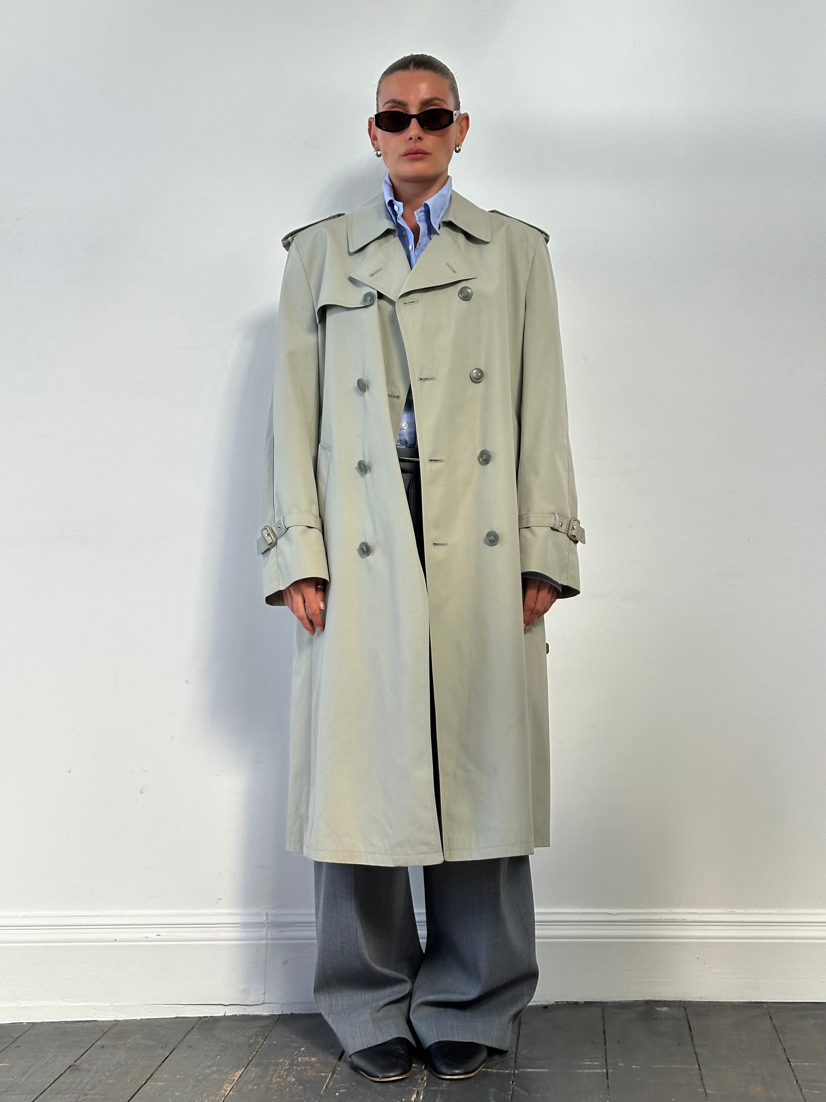 Vintage double-breasted belted trench coat in size XL, classic style with structured collar and button details.
