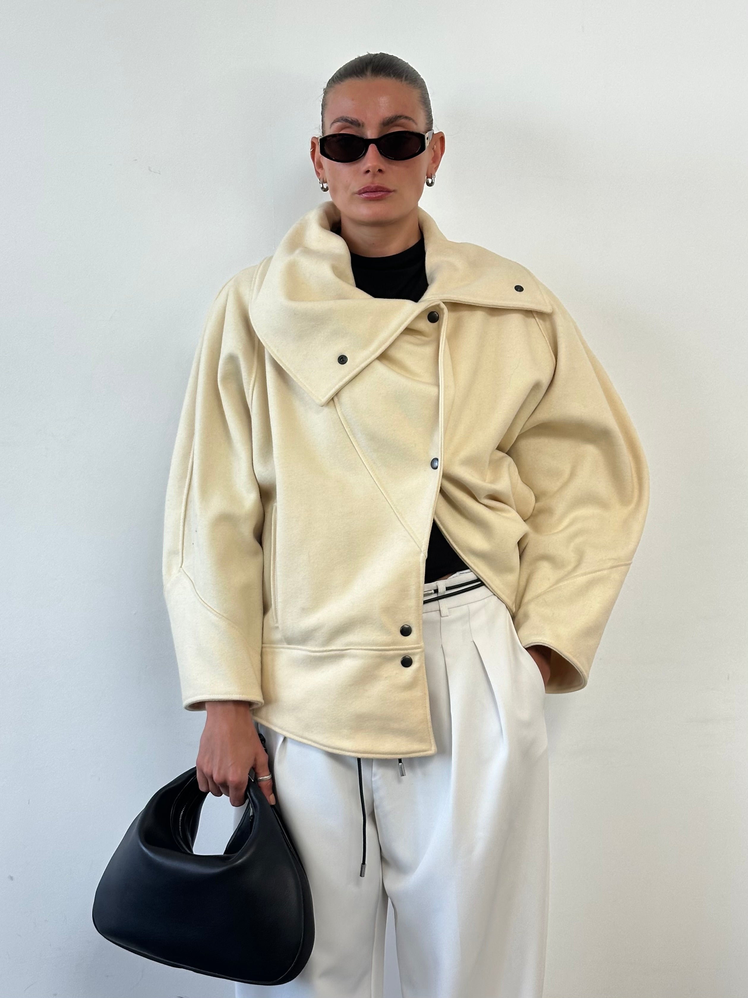 Vintage asymmetric wool bomber jacket with funnel neck in a classic design, shown in a stylish view.