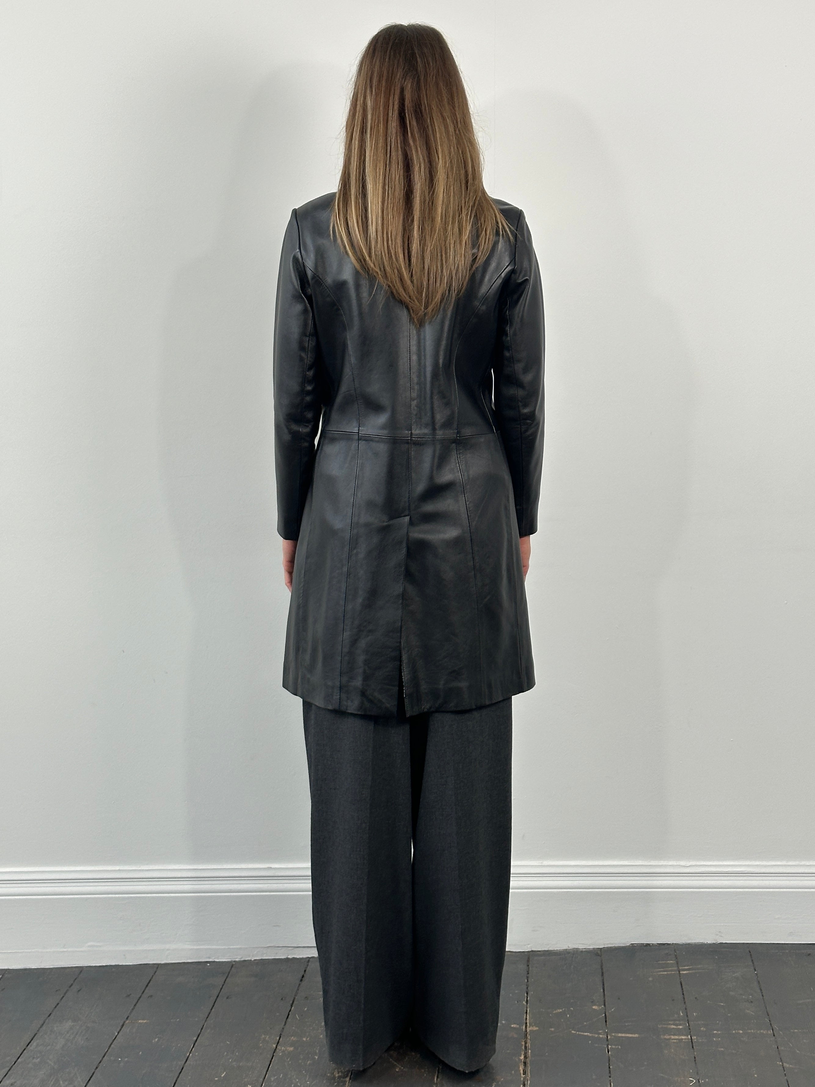 Vintage 1990s minimal high neck leather trench coat, size small, featuring sleek design and classic black leather from Vintage.