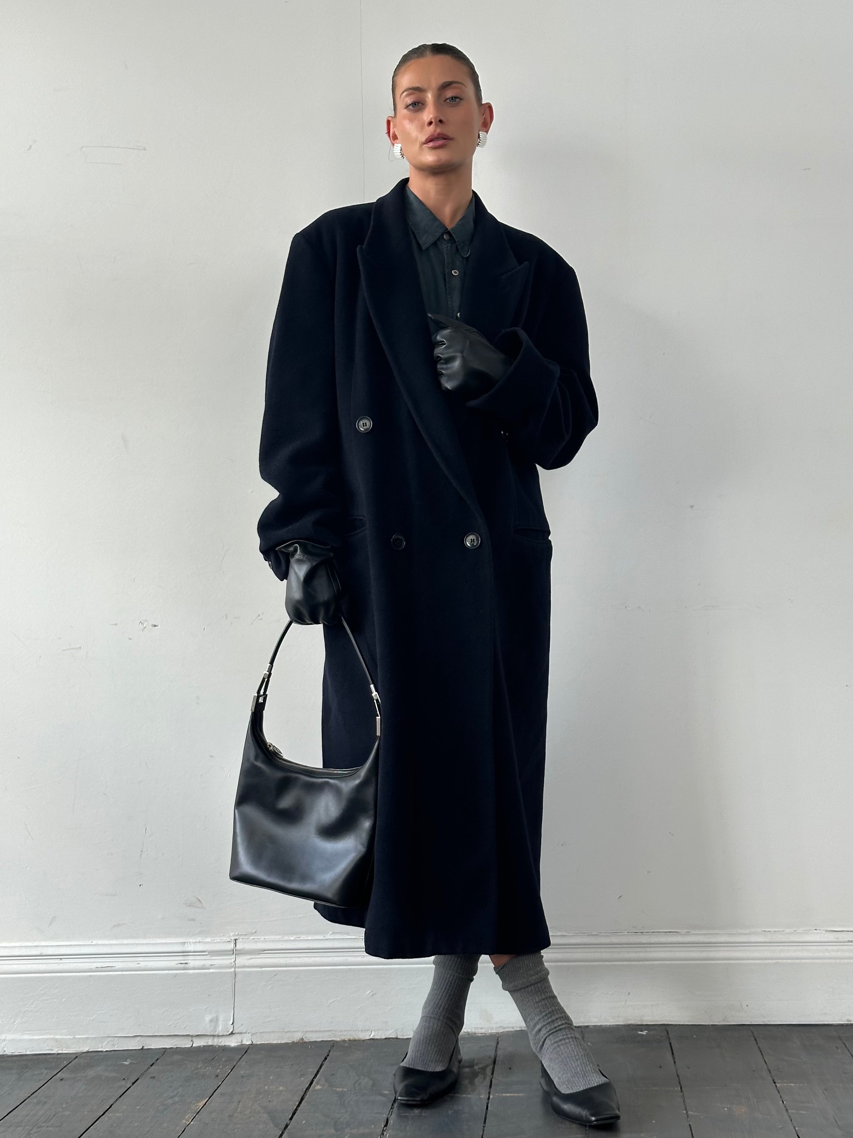 Emporio Armani wool cashmere double-breasted coat in XL/XXL, shown on a hanger, featuring classic design and elegant tailoring.