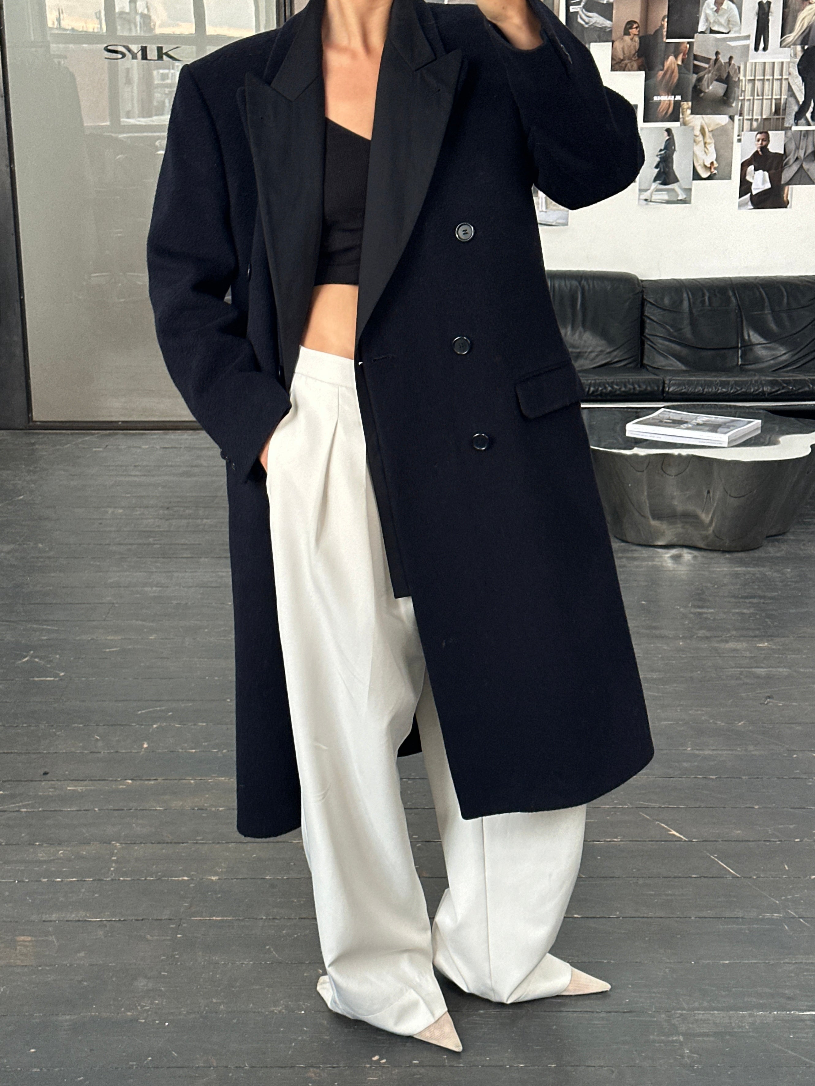 Vintage British 1990s wool cashmere double-breasted coat in XL, featuring classic design and warm, textured fabric.