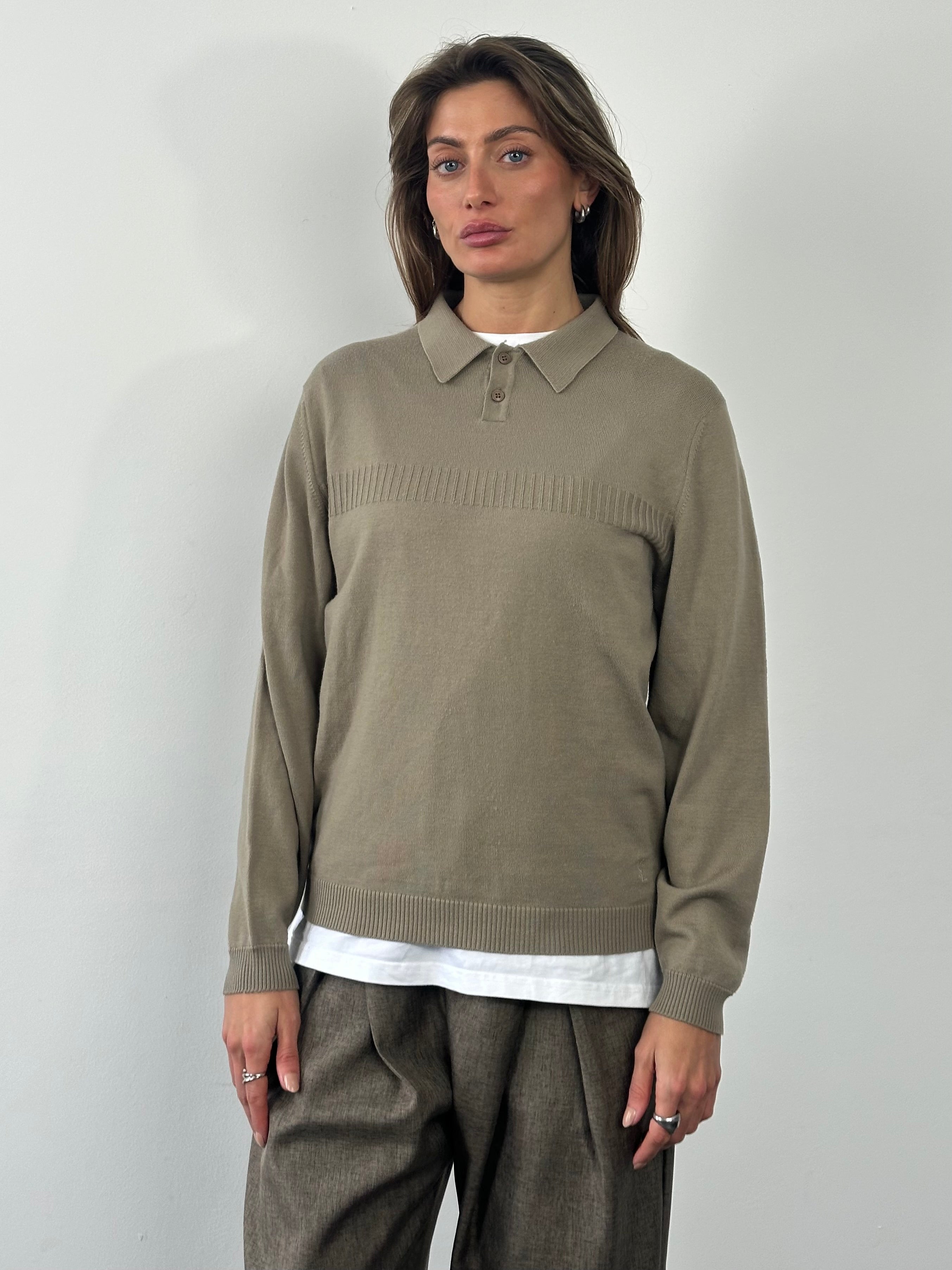 Yves Saint Laurent 1990s wool knit logo jumper in size M, featuring classic design and ribbed cuffs on a neutral background.