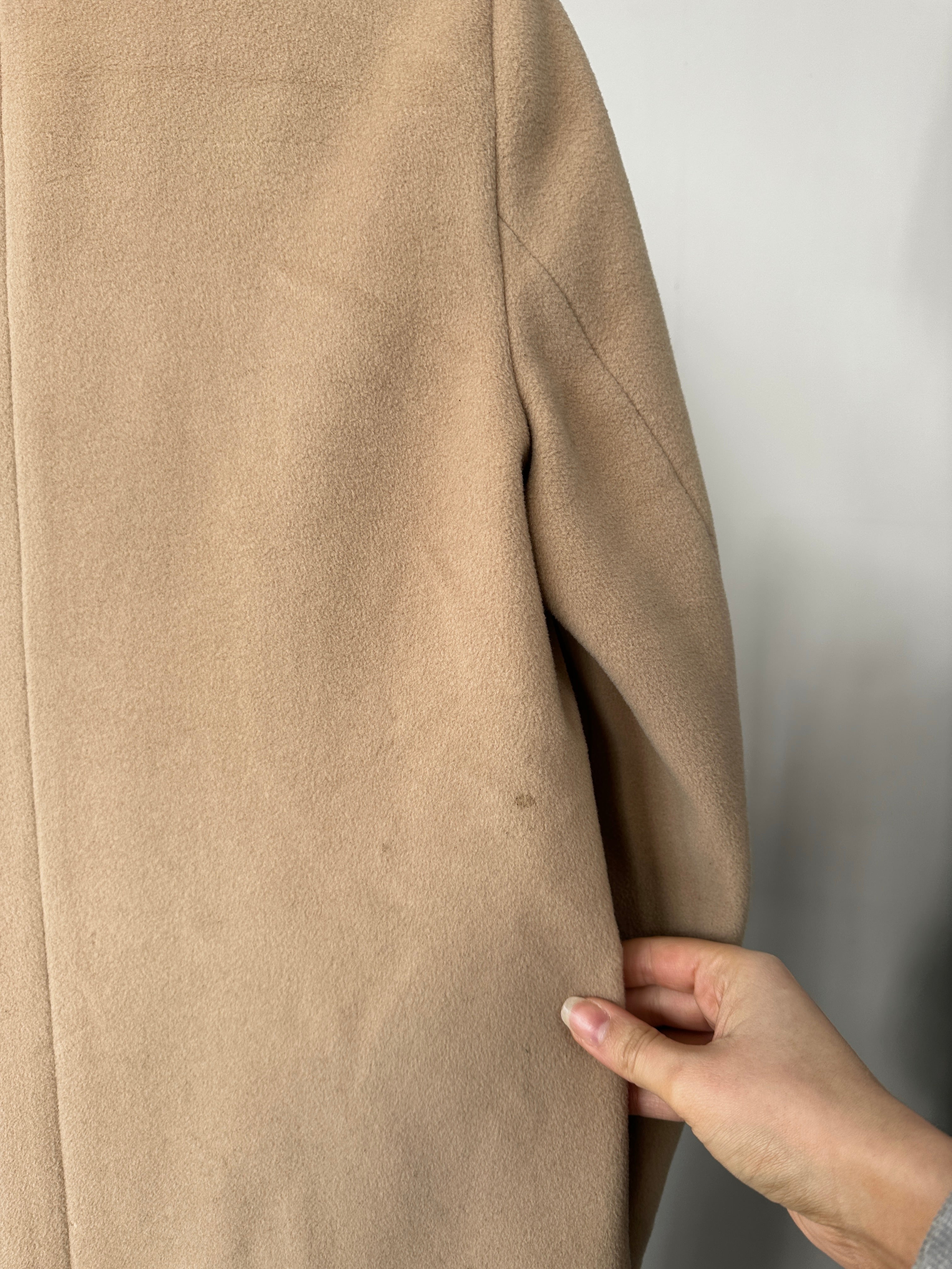 Hugo Boss pure wool single-breasted coat in size S, tailored fit with classic lapels and neutral color, displayed on a hanger.