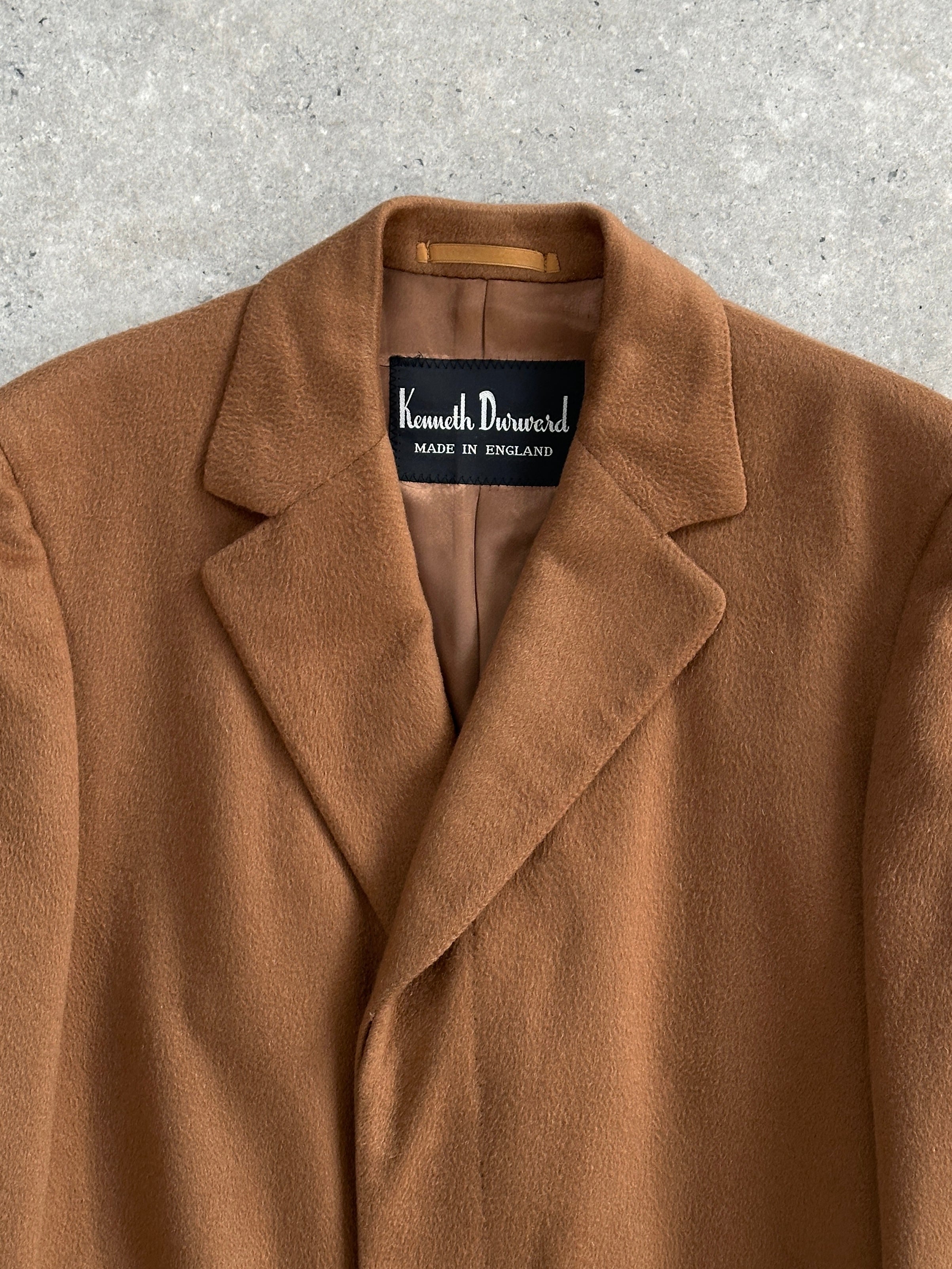 Vintage pure cashmere coat with concealed placket in size L/XL, showcasing a luxurious, warm, and stylish outerwear piece.