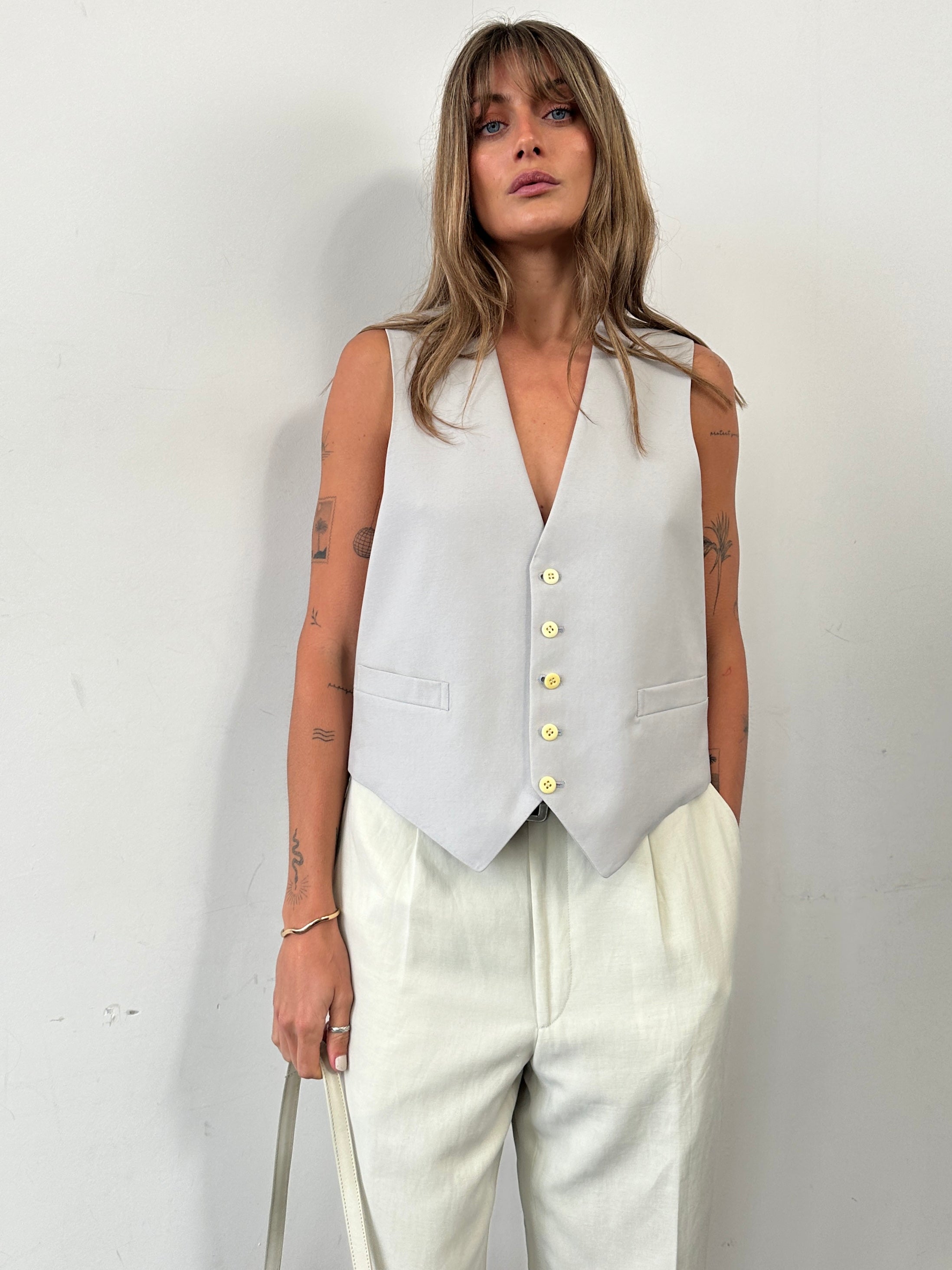 Vintage Pure Wool Tailored Waistcoat in M/L size, classic design, with button details and tailored fit, made from high-quality wool.