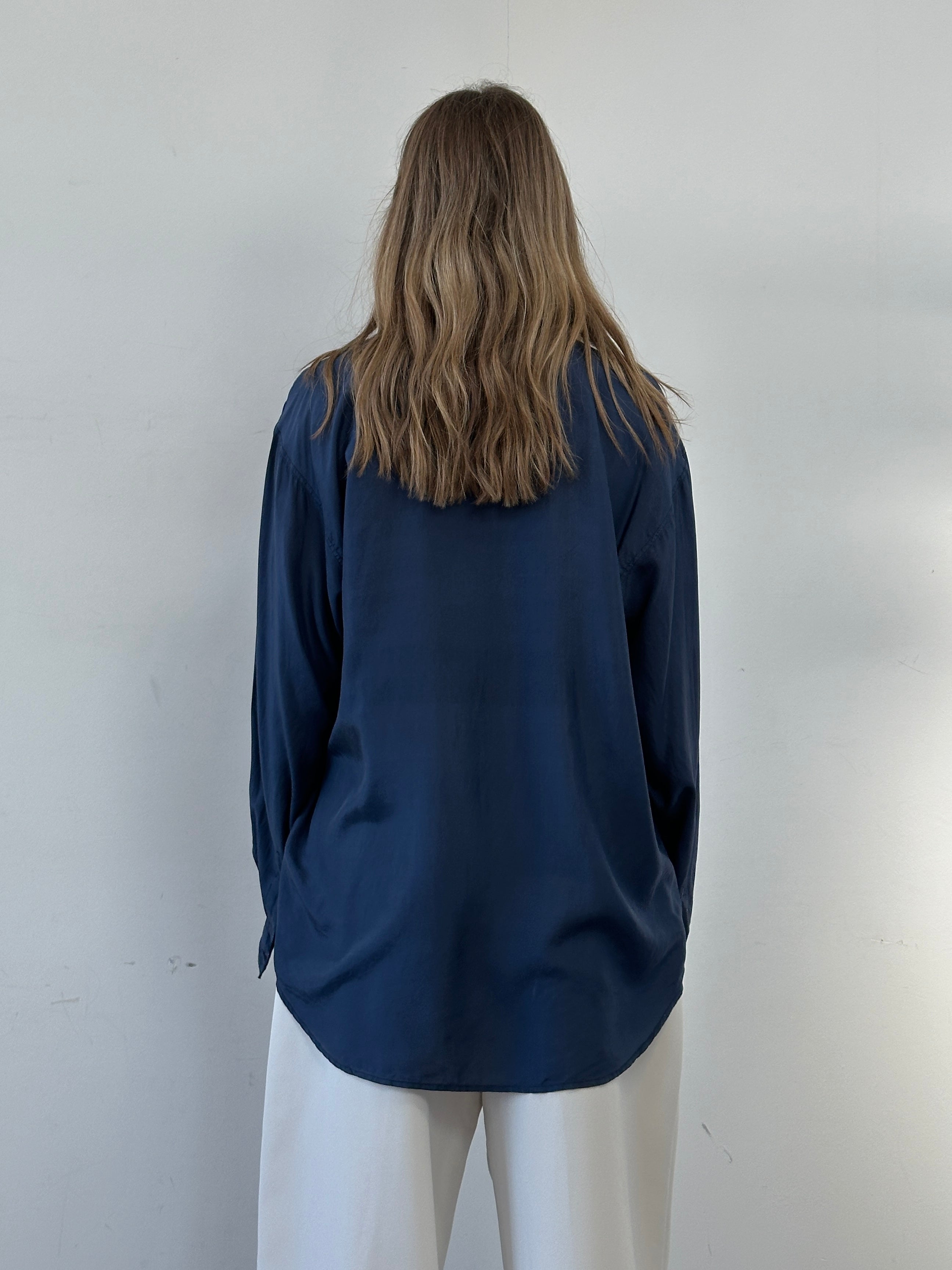 Vintage relaxed pure silk shirt in XL size, featuring smooth fabric and classic collar, displayed on a hanger.