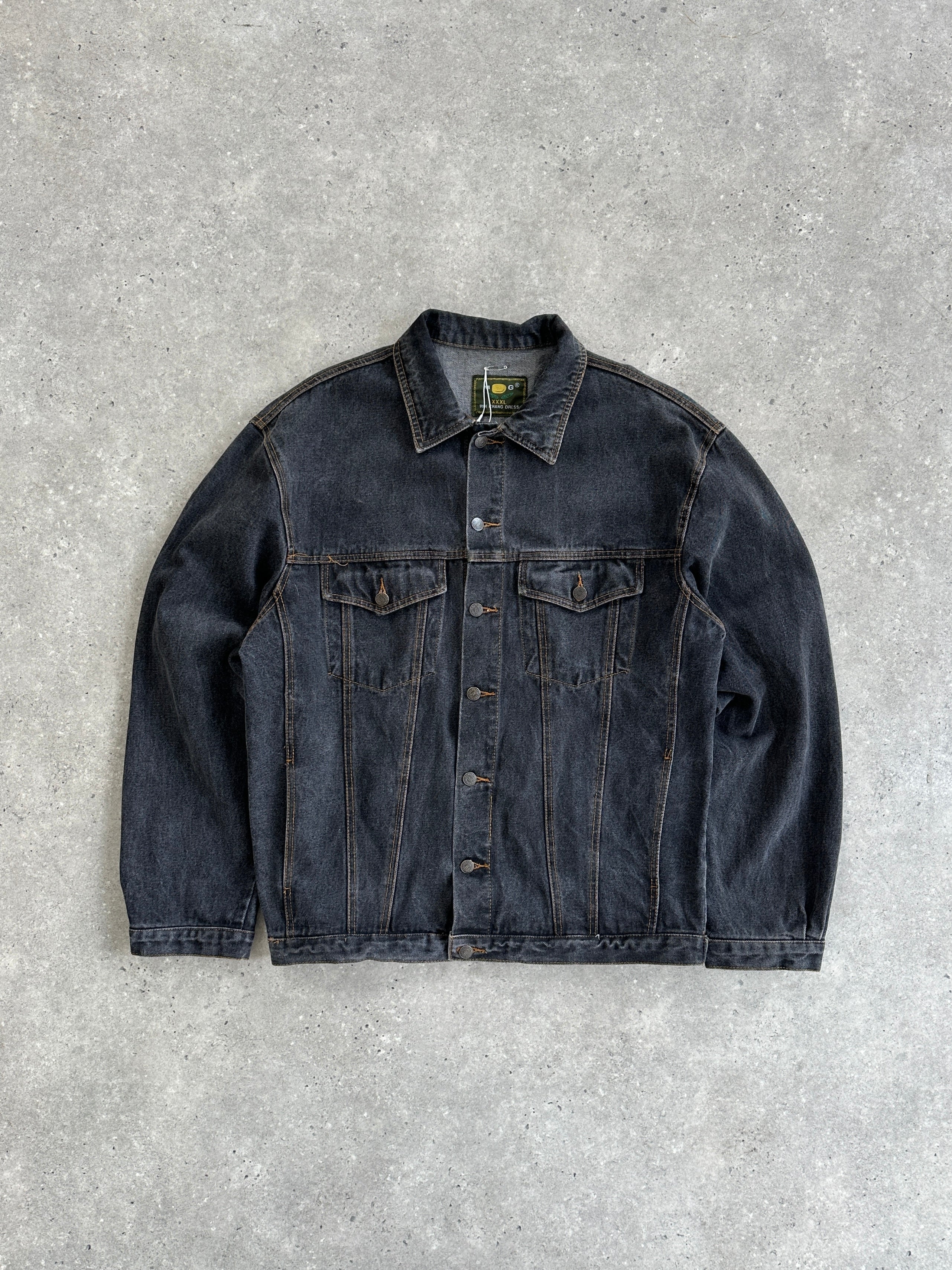 Vintage oversized washed denim jacket in XXL, featuring classic design with faded blue denim and button front detail.