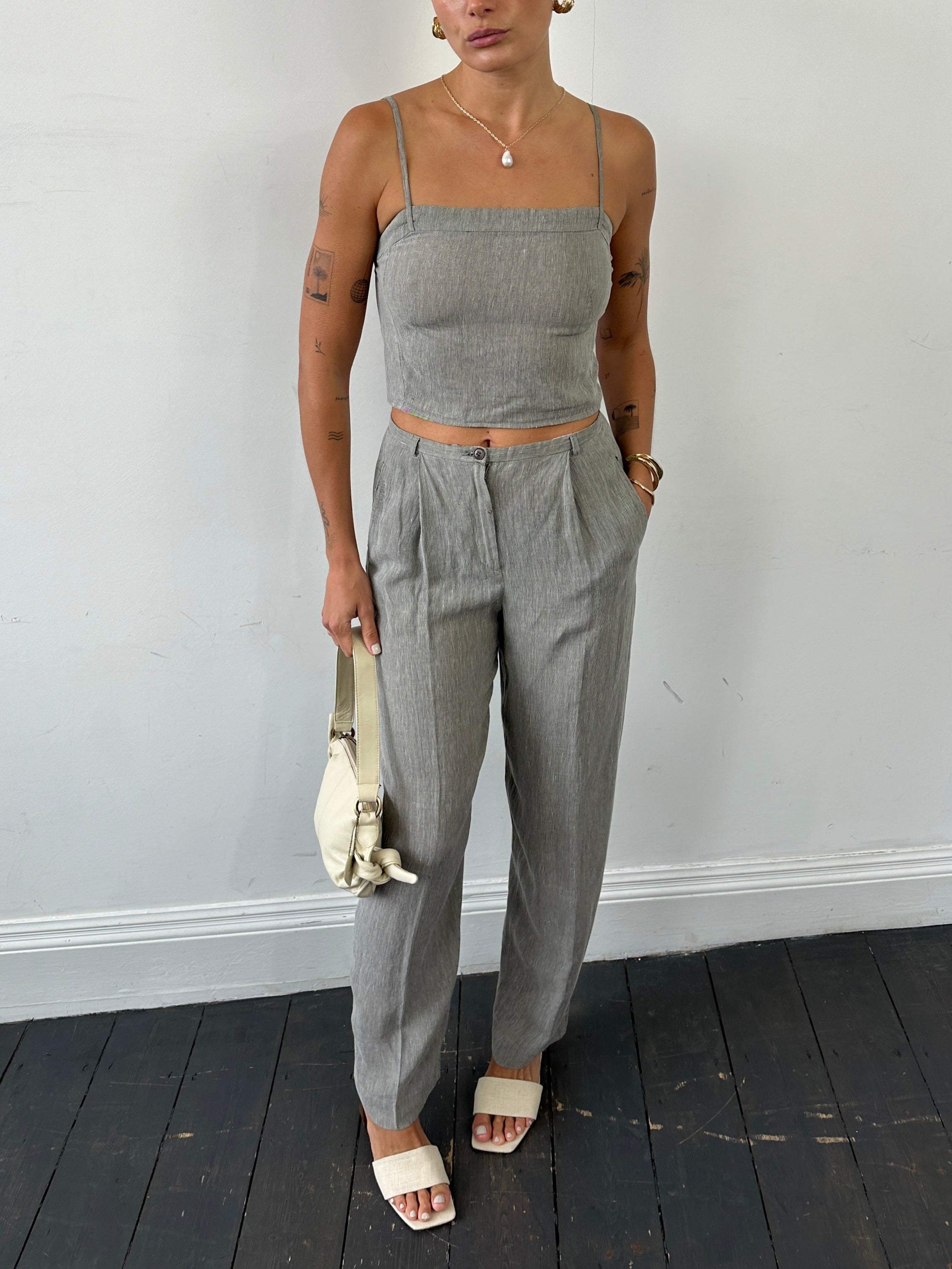 Mani linen two-piece top and trouser co-ord set, featuring lightweight fabric, relaxed fit, and stylish design in neutral tones.