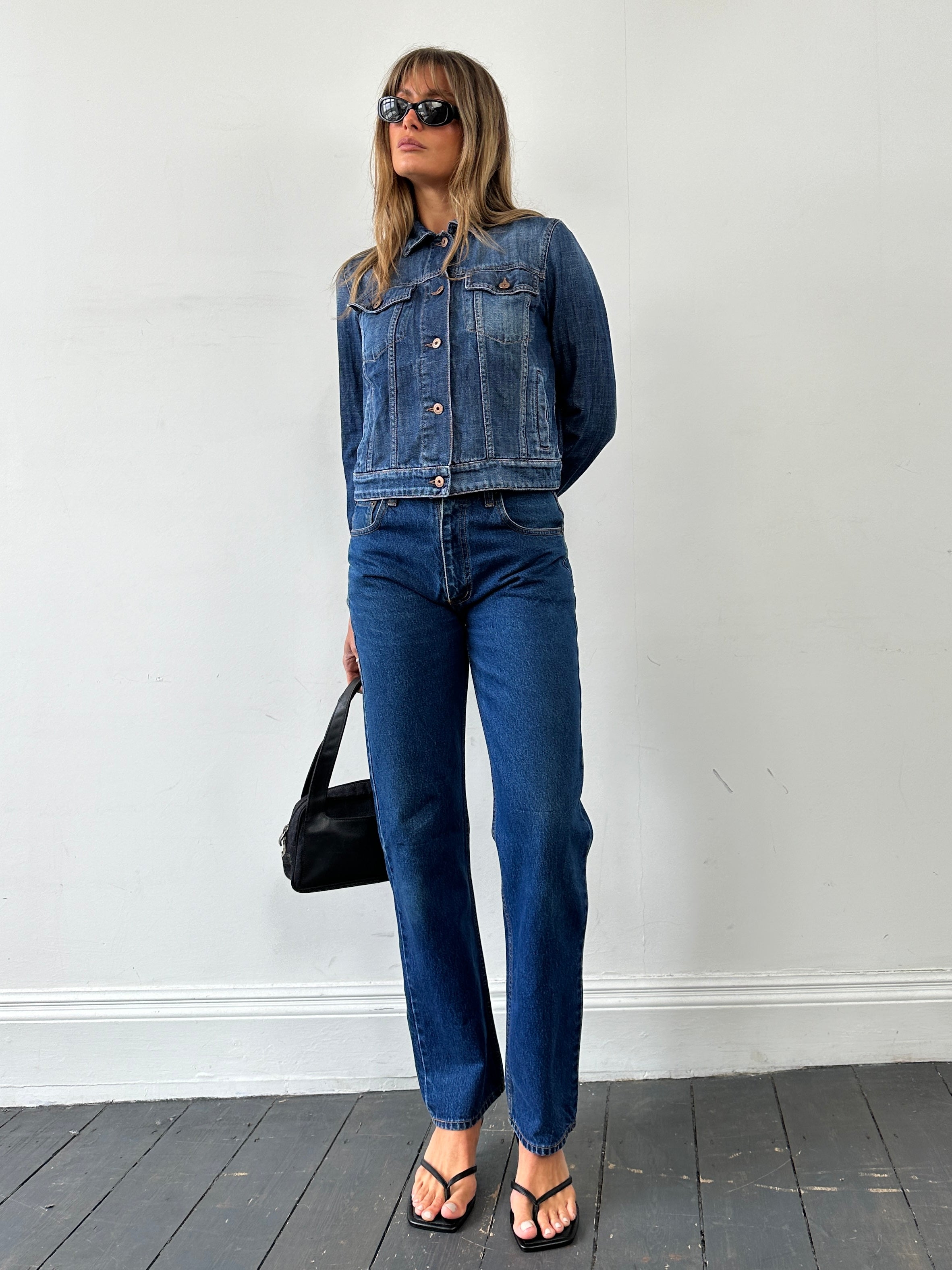 Vintage pure cotton straight leg denim jeans in size W28, shown in classic blue with visible stitching and five-pocket design.