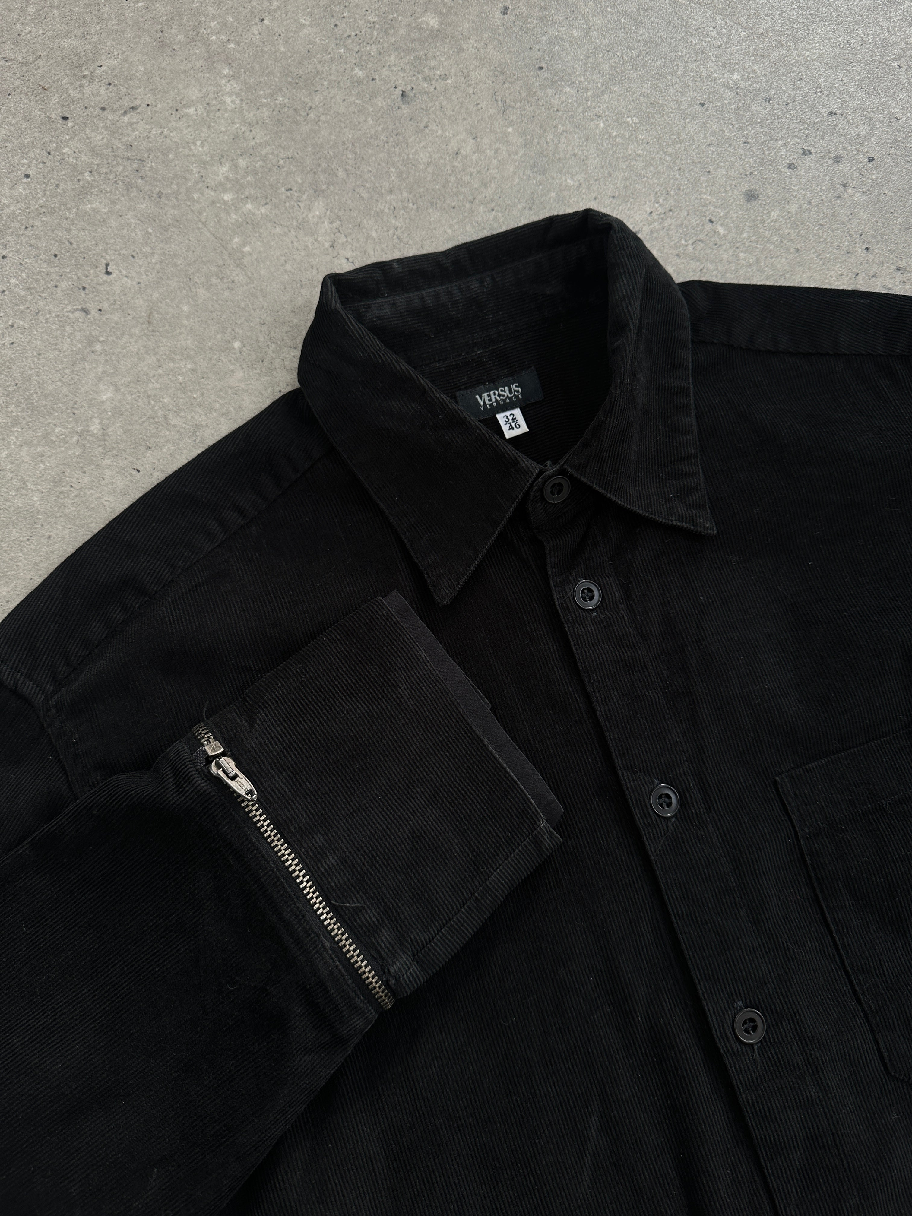 Versace Versus 00s corduroy zip shirt in black, featuring a classic collar and front zipper, stylish and trendy men's shirt.