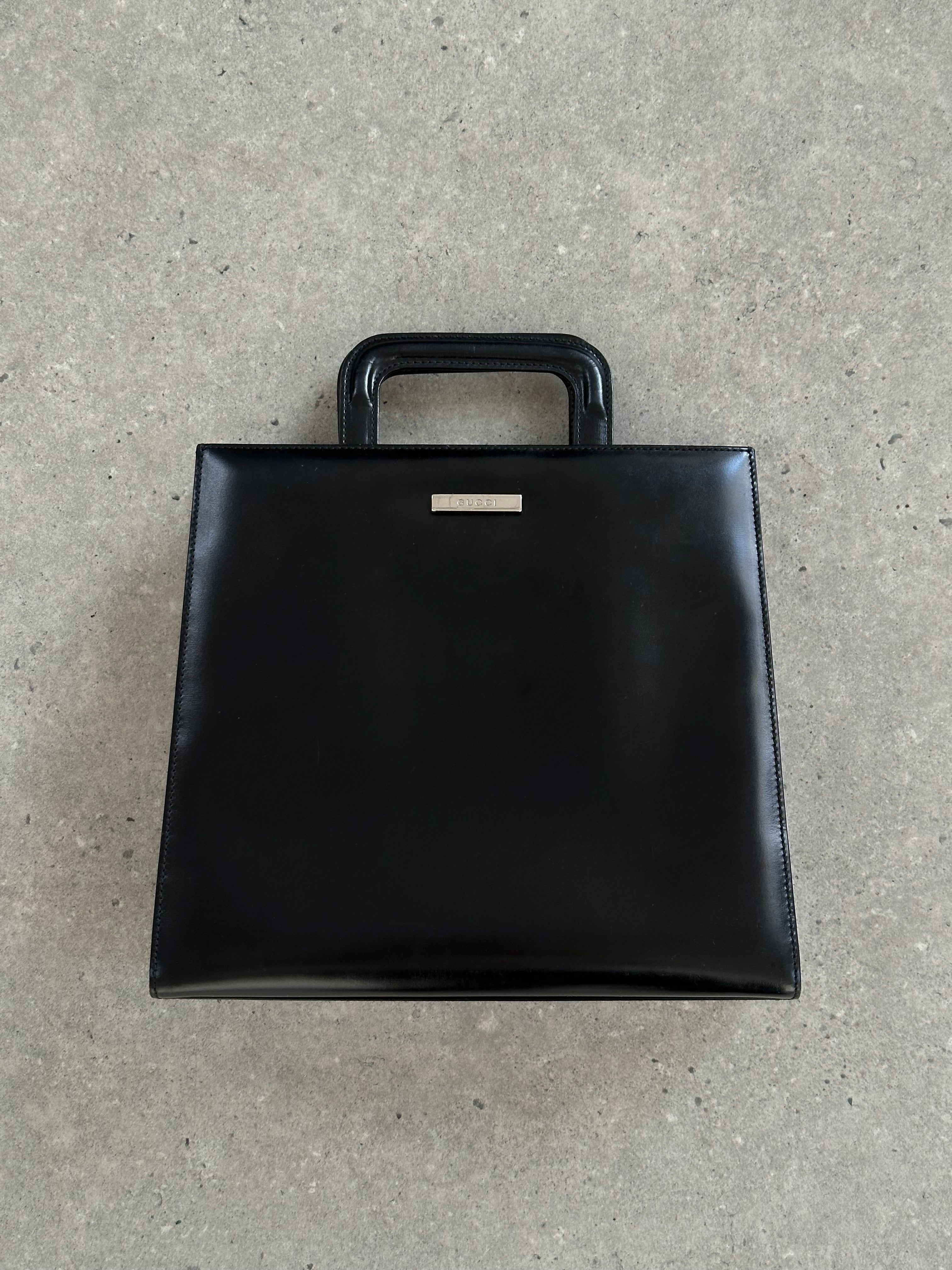 Gucci 1990s Tom Ford 2-in-1 leather and vinyl handbag with top handle and adjustable strap, stylish vintage designer bag