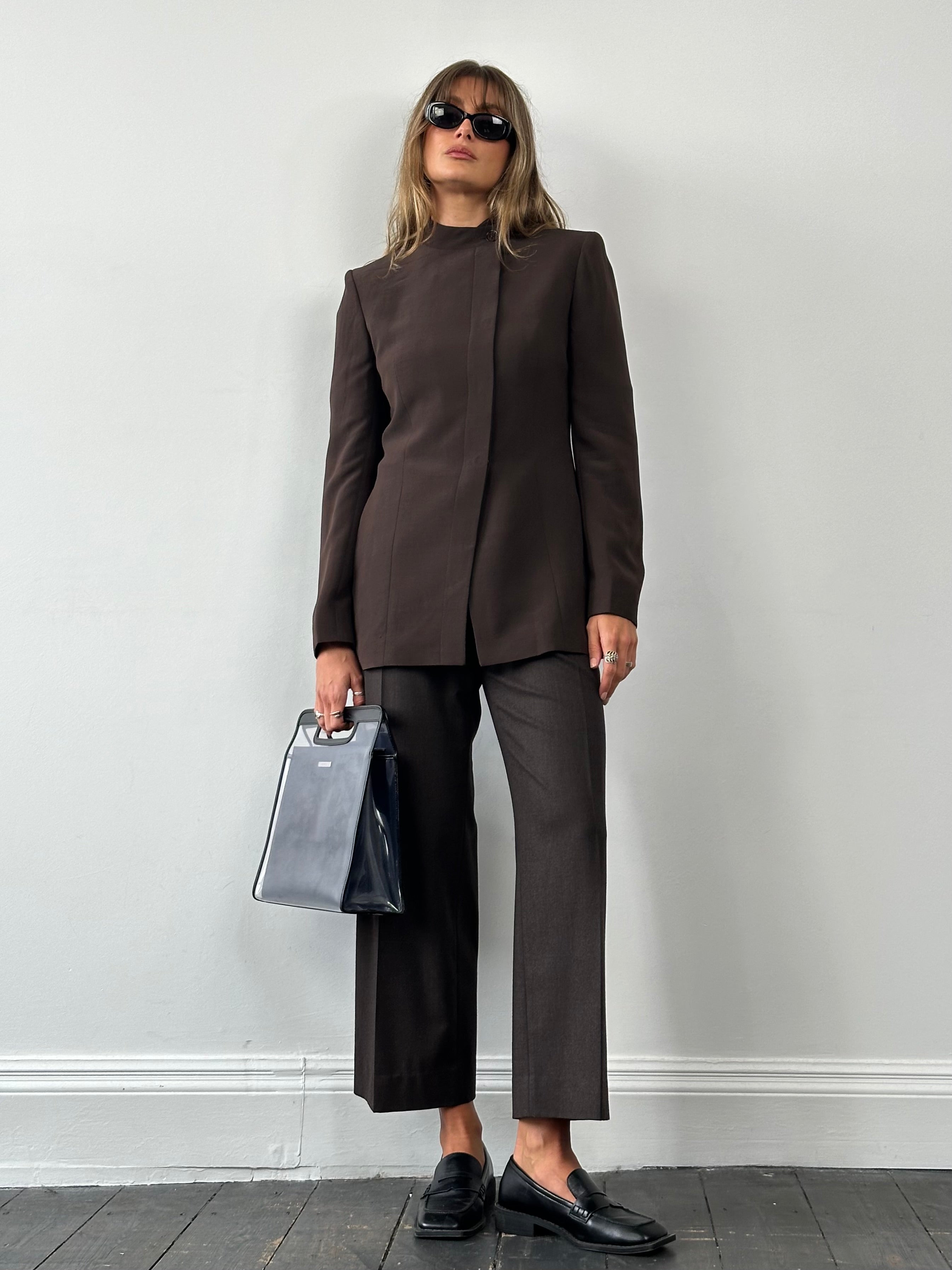 Max Mara 2000s fitted high neck asymmetric tailored blazer in dark fabric, showing close-up of collar and front details.
