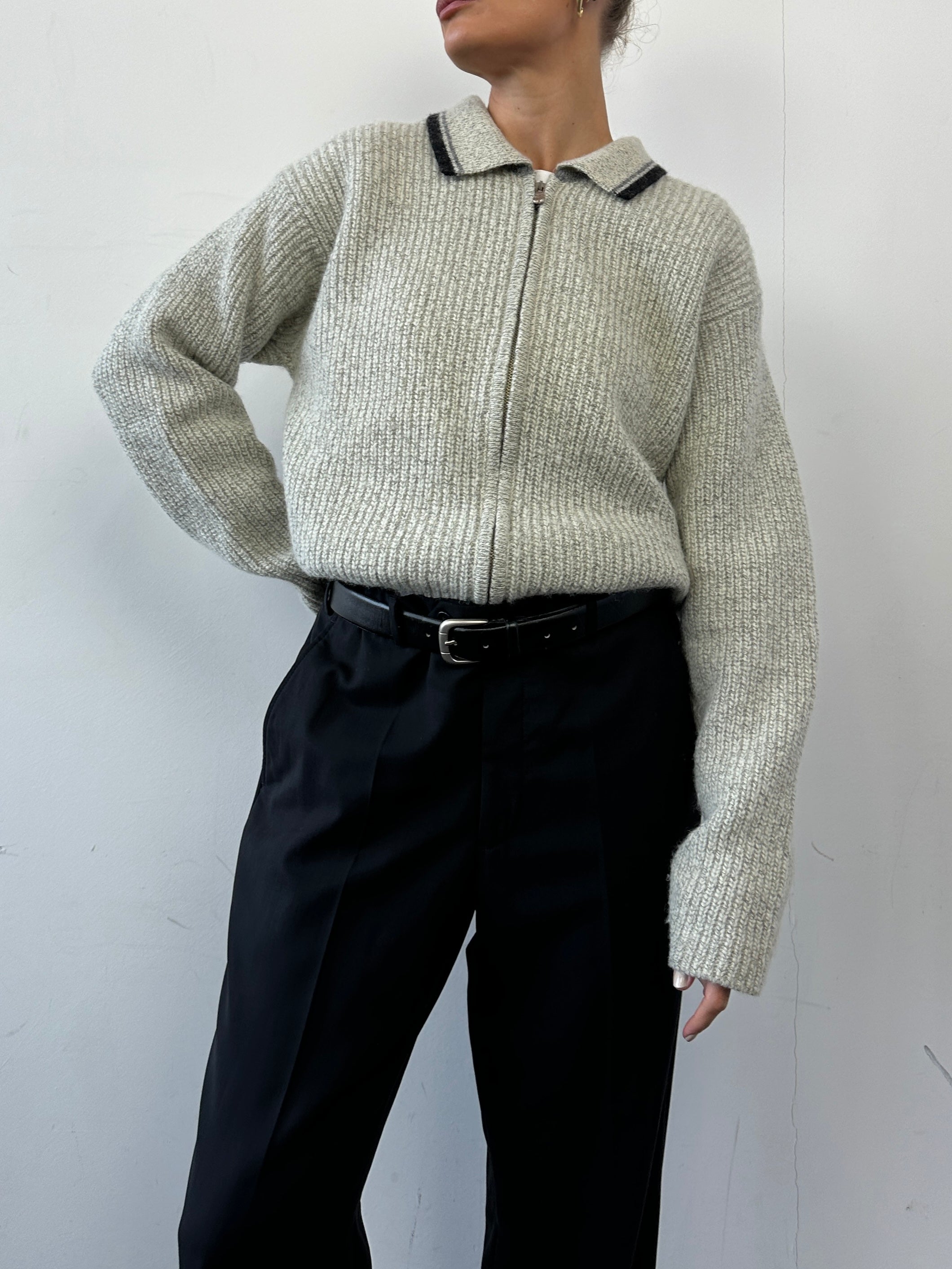 Levi’s wool zip-up knitted cardigan in size L with a cozy, textured knit pattern and full front zipper.