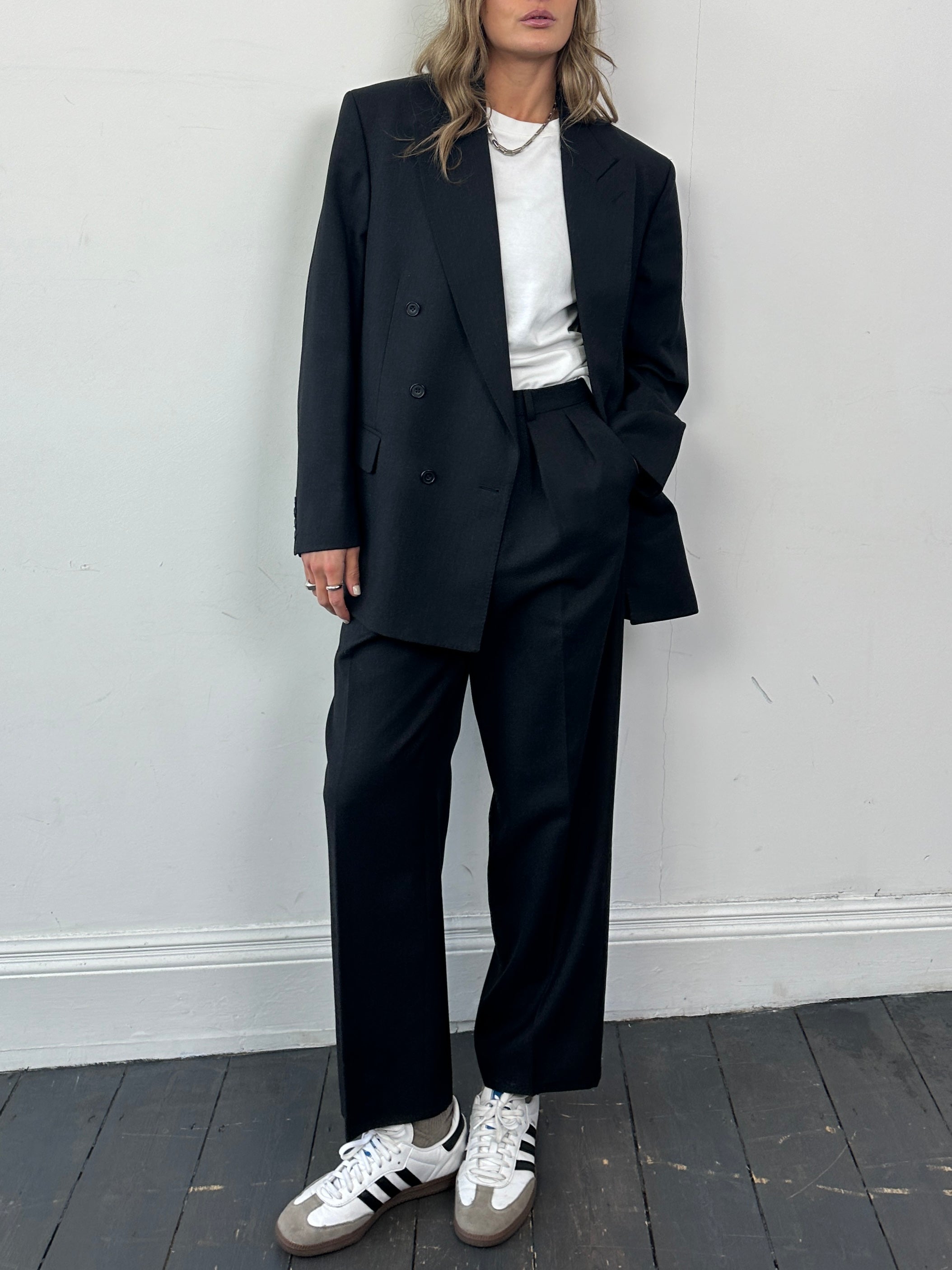 Christian Dior pure wool double-breasted jumpsuit in navy, featuring tailored fit and classic lapel design.