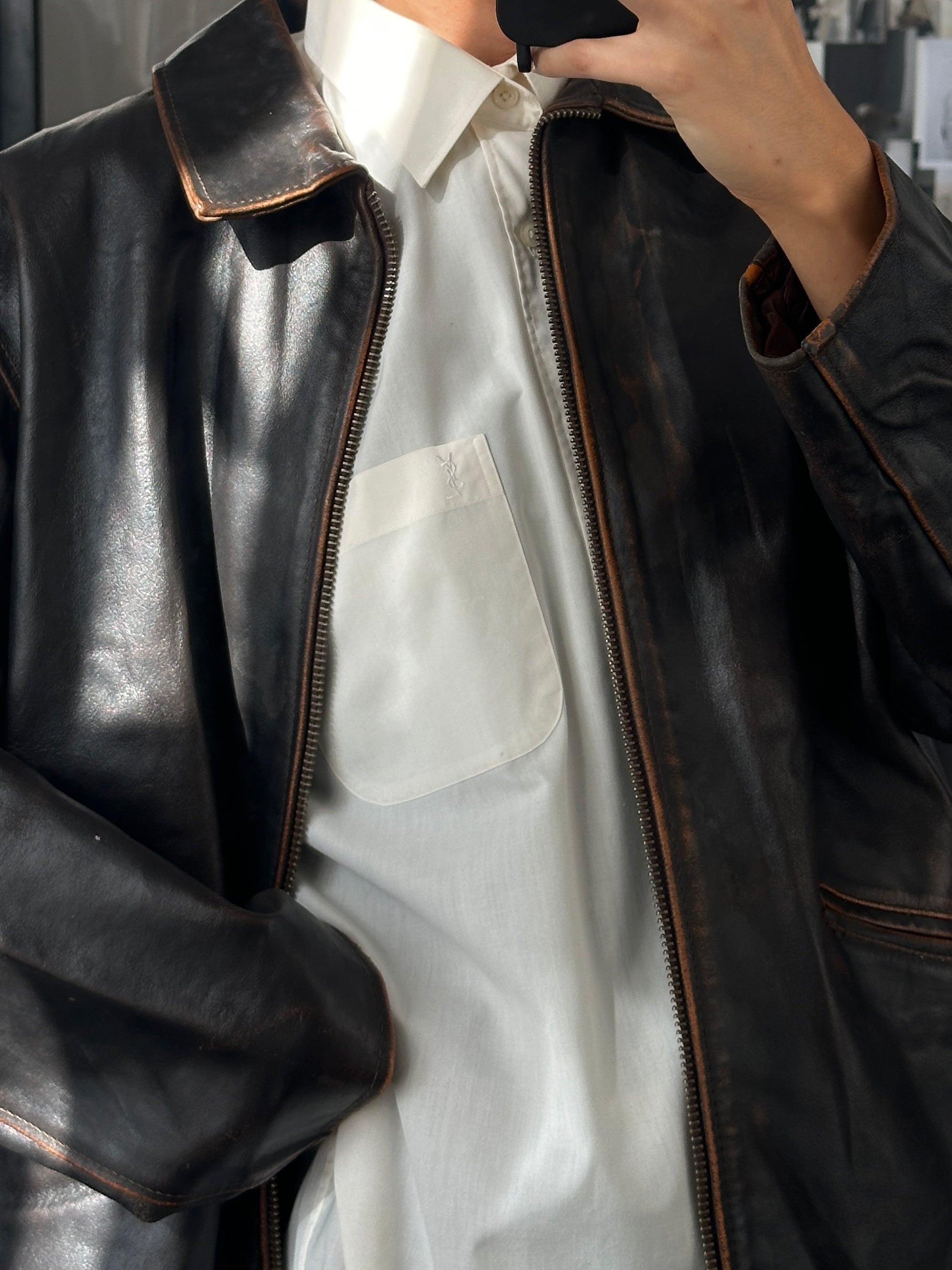 Vintage Italian 1990s distressed leather jacket, men's size L/XL, featuring rugged styling and aged leather details.