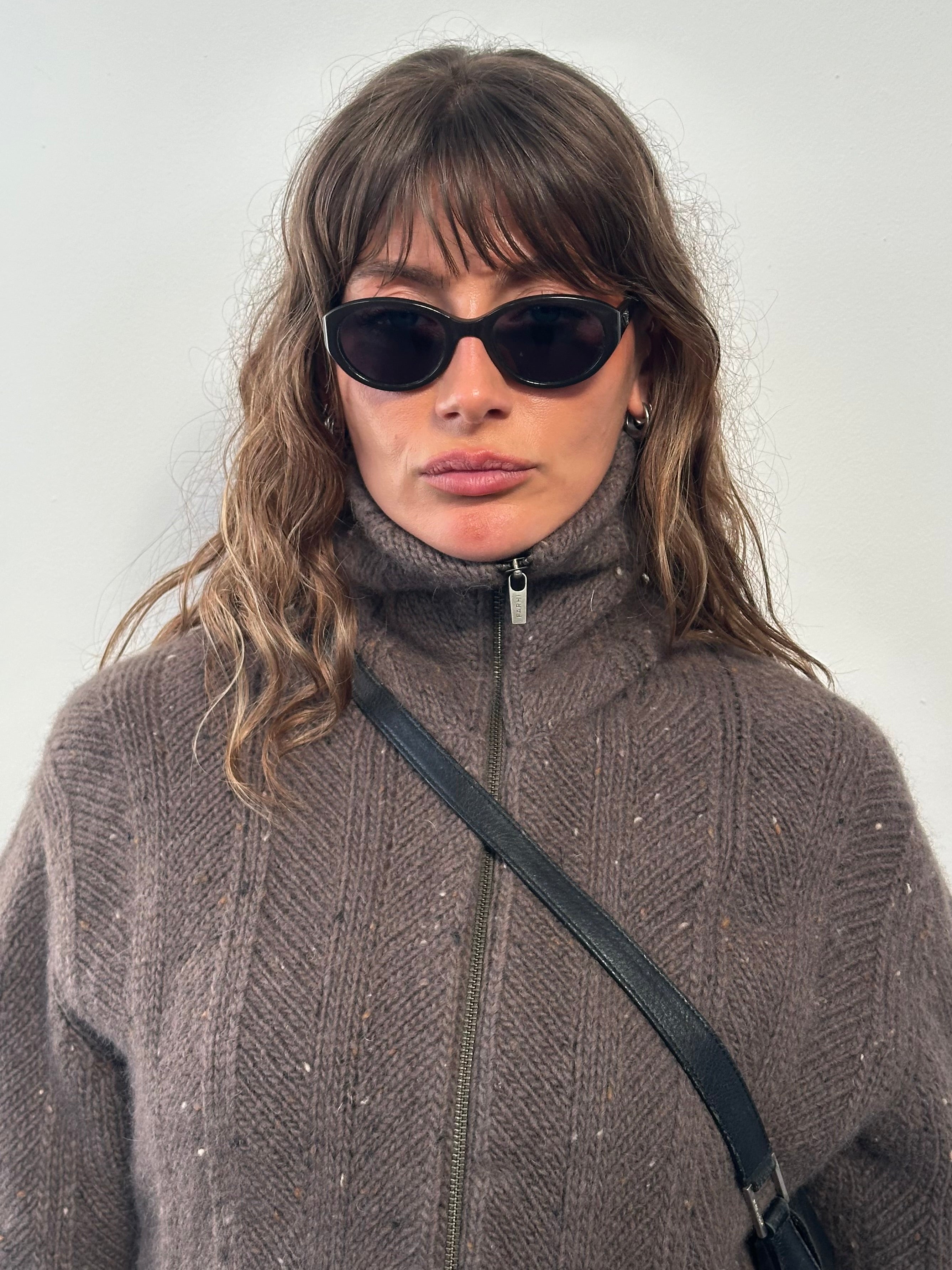 Nicole Farhi Farhi 1990s pure wool funnel neck bomber jacket in size M/L, featuring classic design and textured wool fabric.