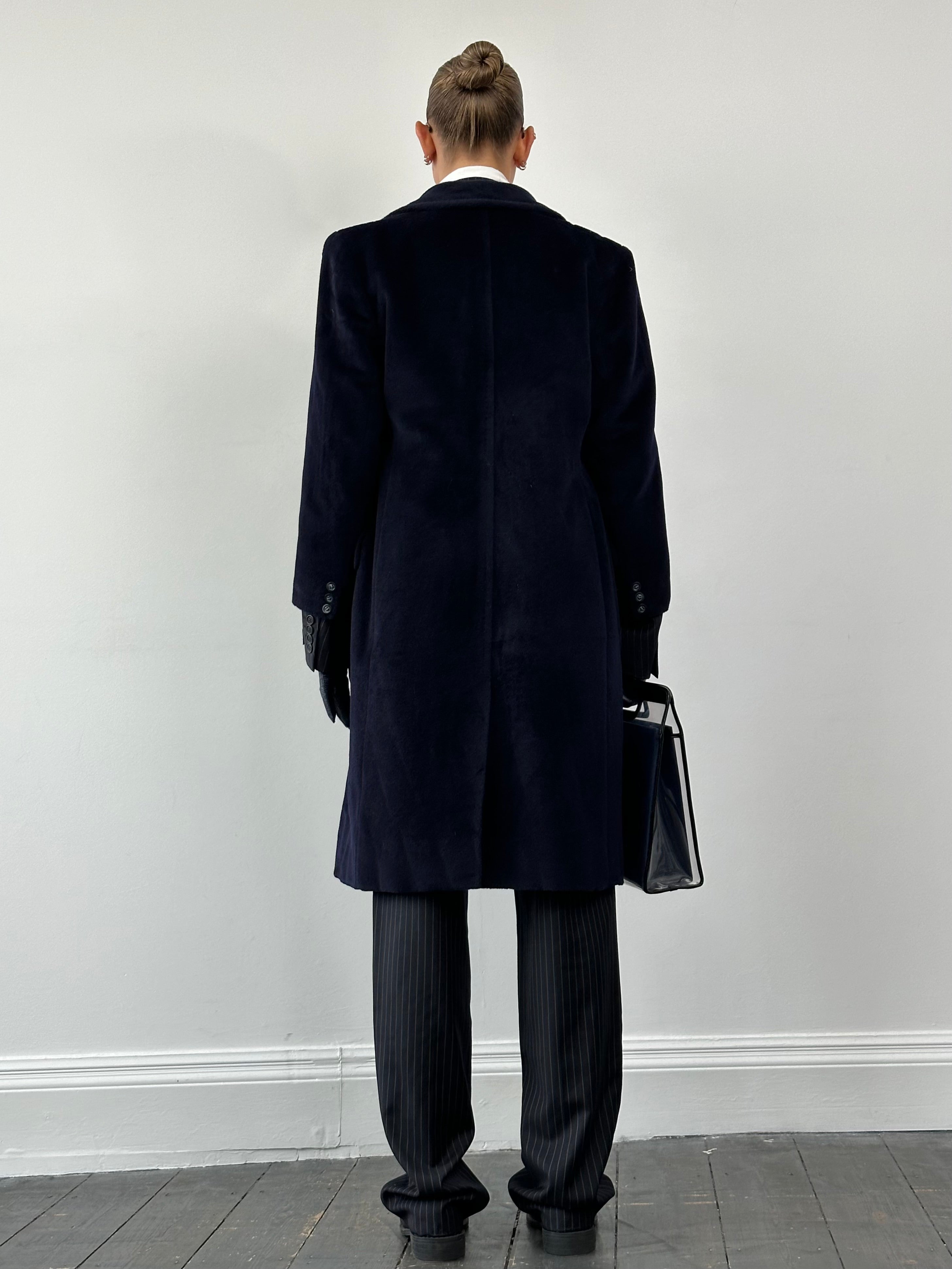 Max Mara pure wool double-breasted coat in classic design, featuring wide lapels and a tailored fit, shown on a model.