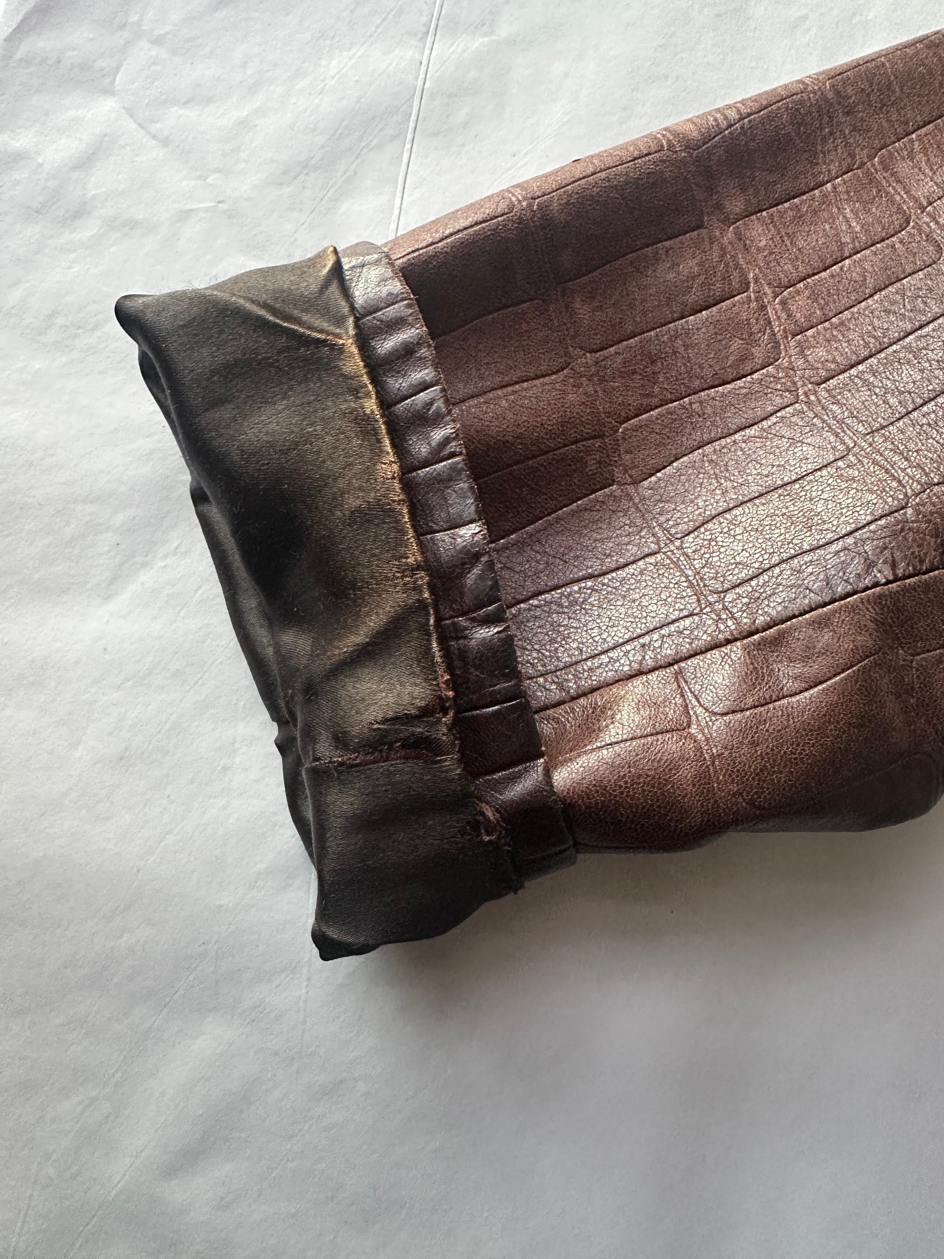 Emporio Armani 1990s leather jacket in size S/M, featuring classic design and high-quality leather, displayed on a neutral background.