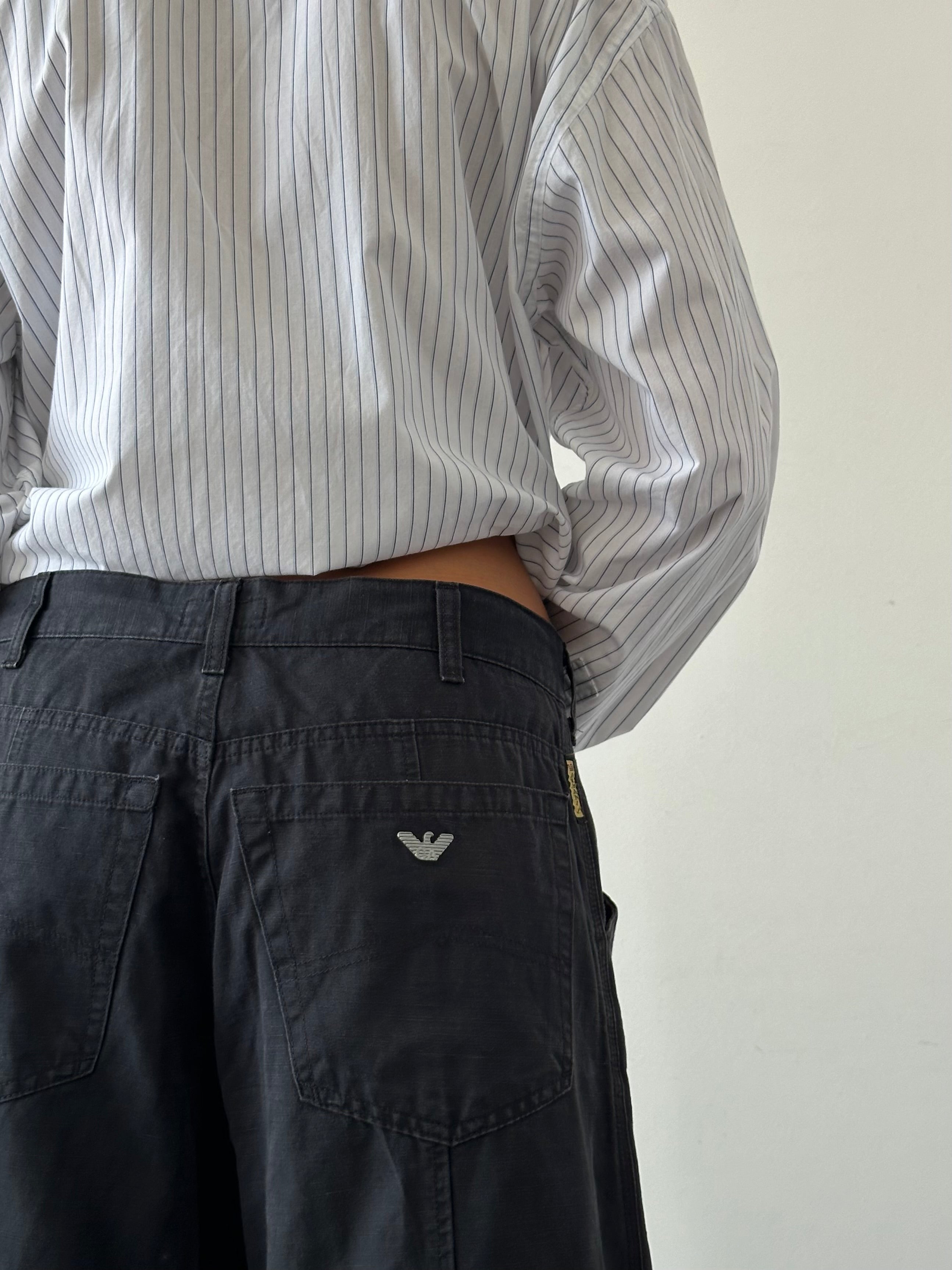 Armani Jeans wide-leg cotton trousers in size W32, featuring a relaxed fit and classic design, shown on a neutral background.