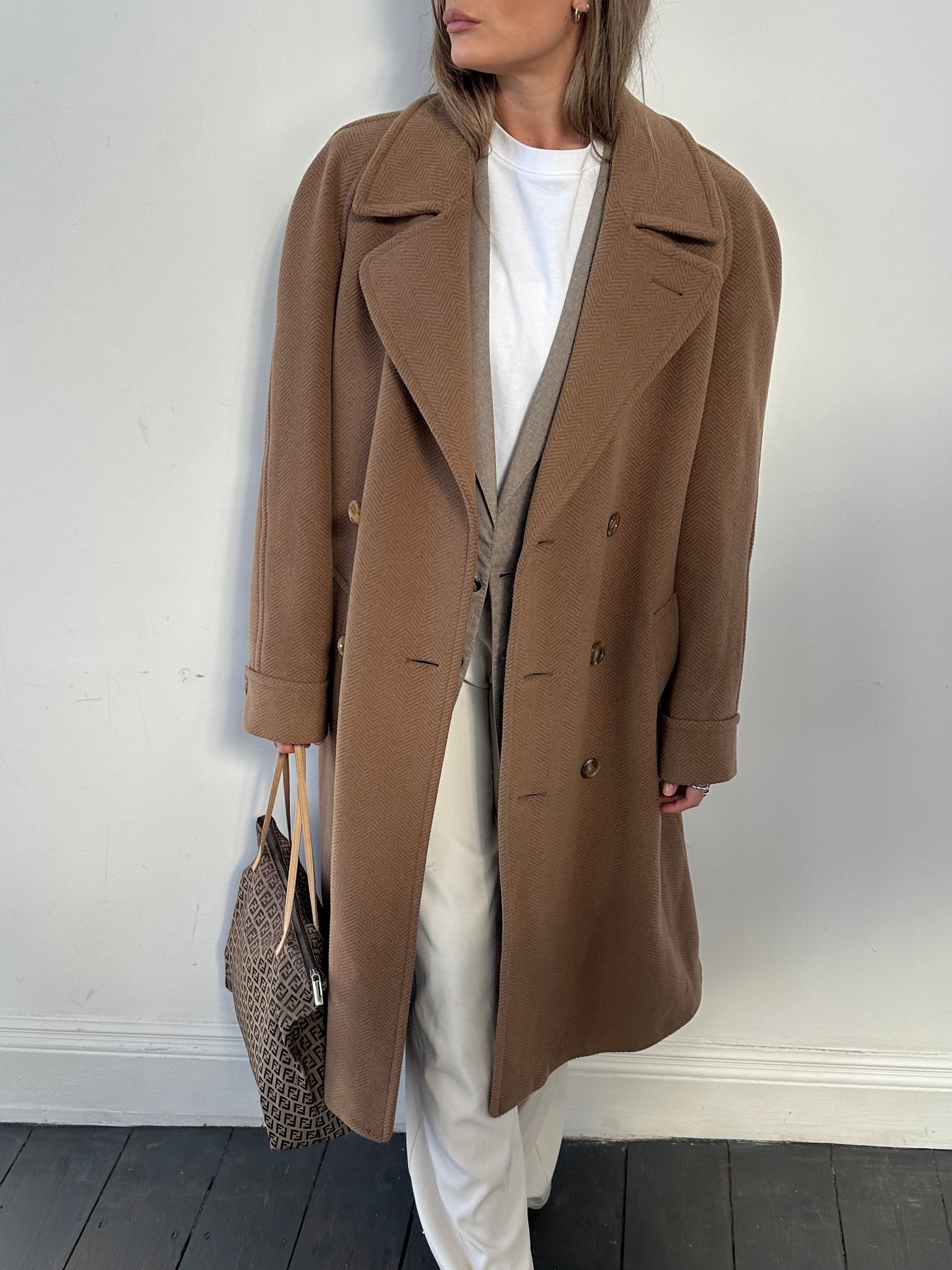 Christian Dior belted double-breasted wool coat in size large, featuring classic tailored design and elegant button details.