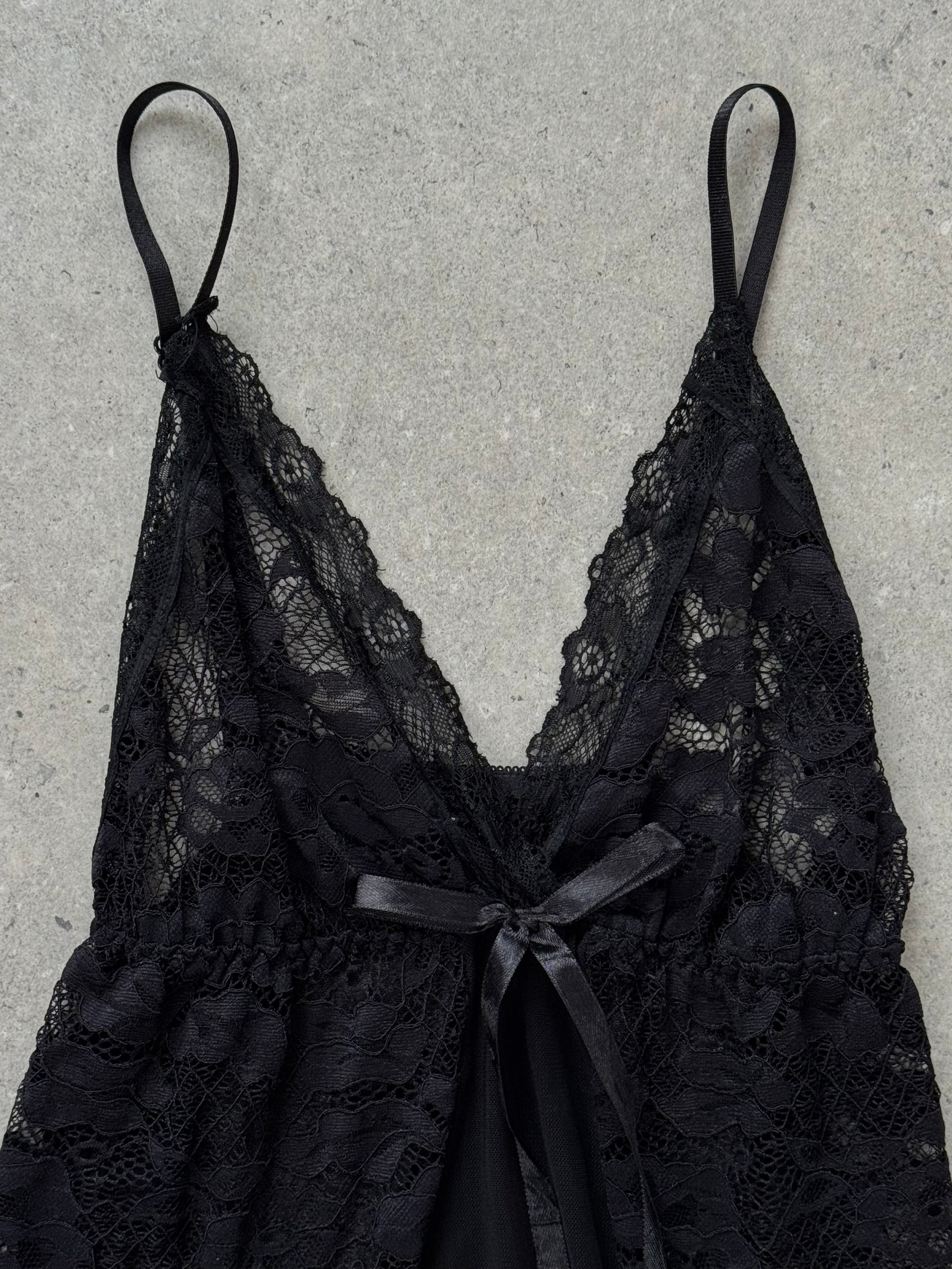 Vintage 1990s sheer lace top, size small, featuring delicate floral lace pattern and classic vintage style.