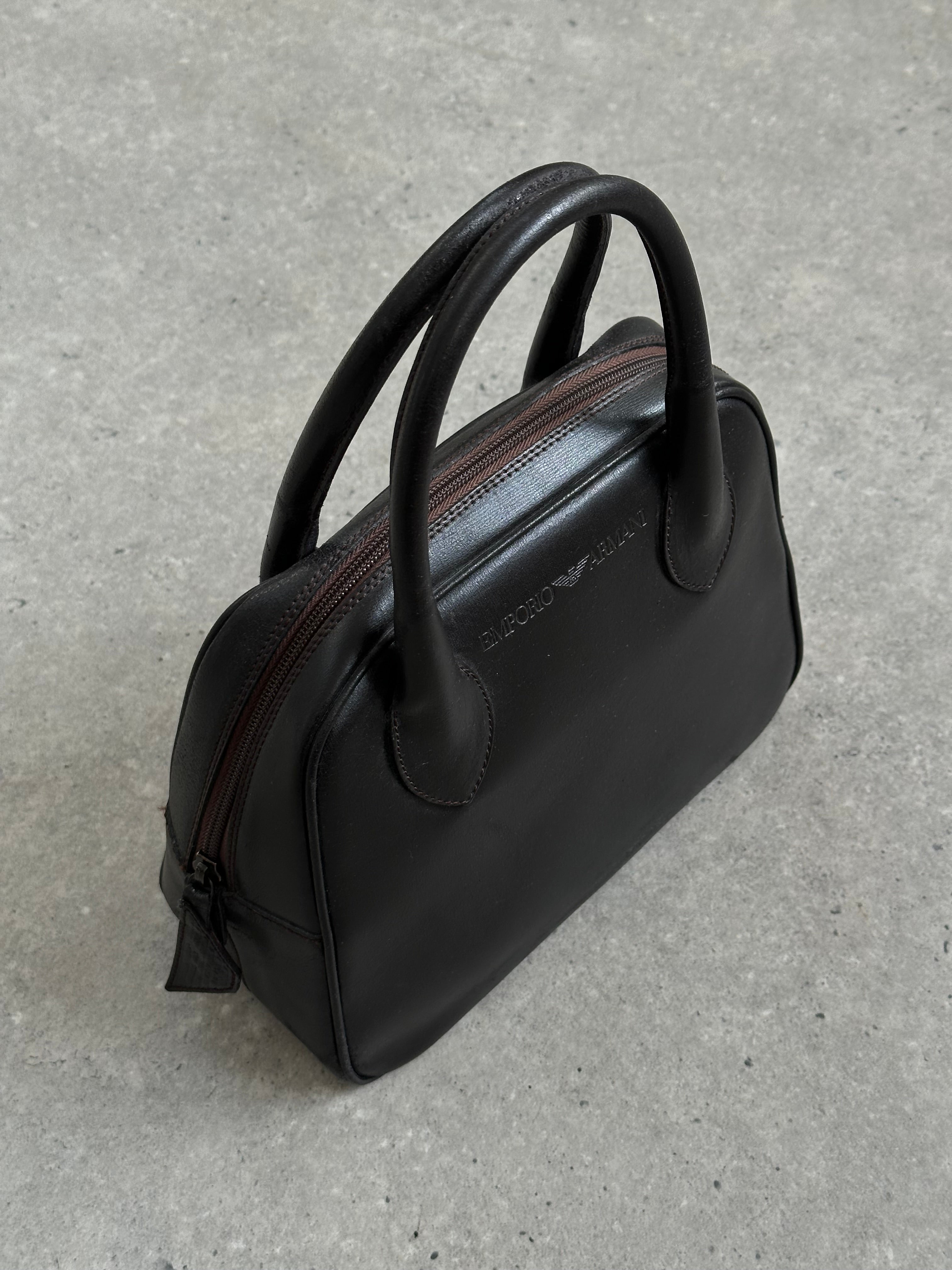 Emporio Armani 2000s leather handbag with sleek design and subtle branding, featuring a structured shape and stylish finish.