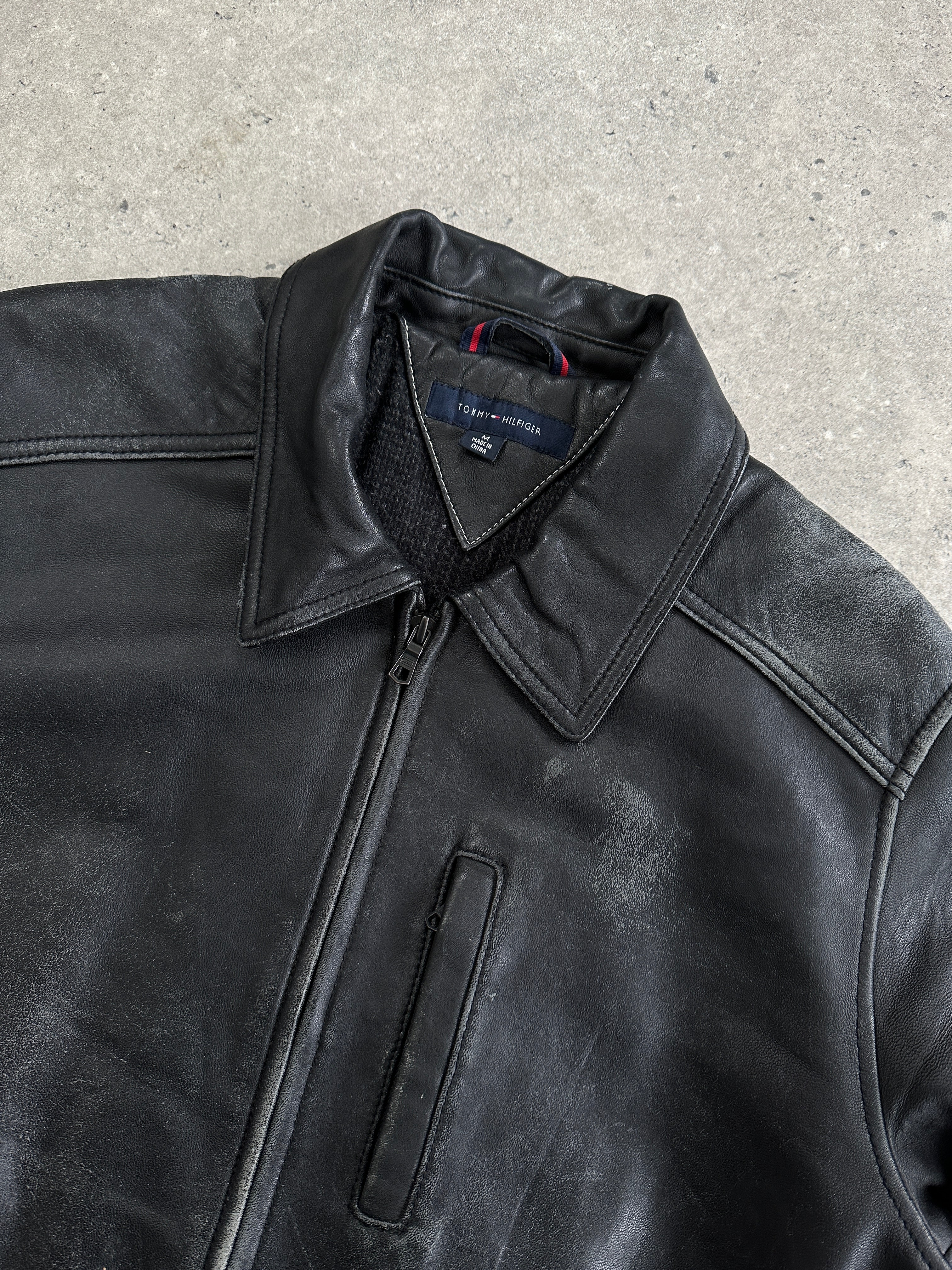 Tommy Hilfiger distressed leather bomber jacket in medium size with a stylish, rugged design and classic bomber silhouette.