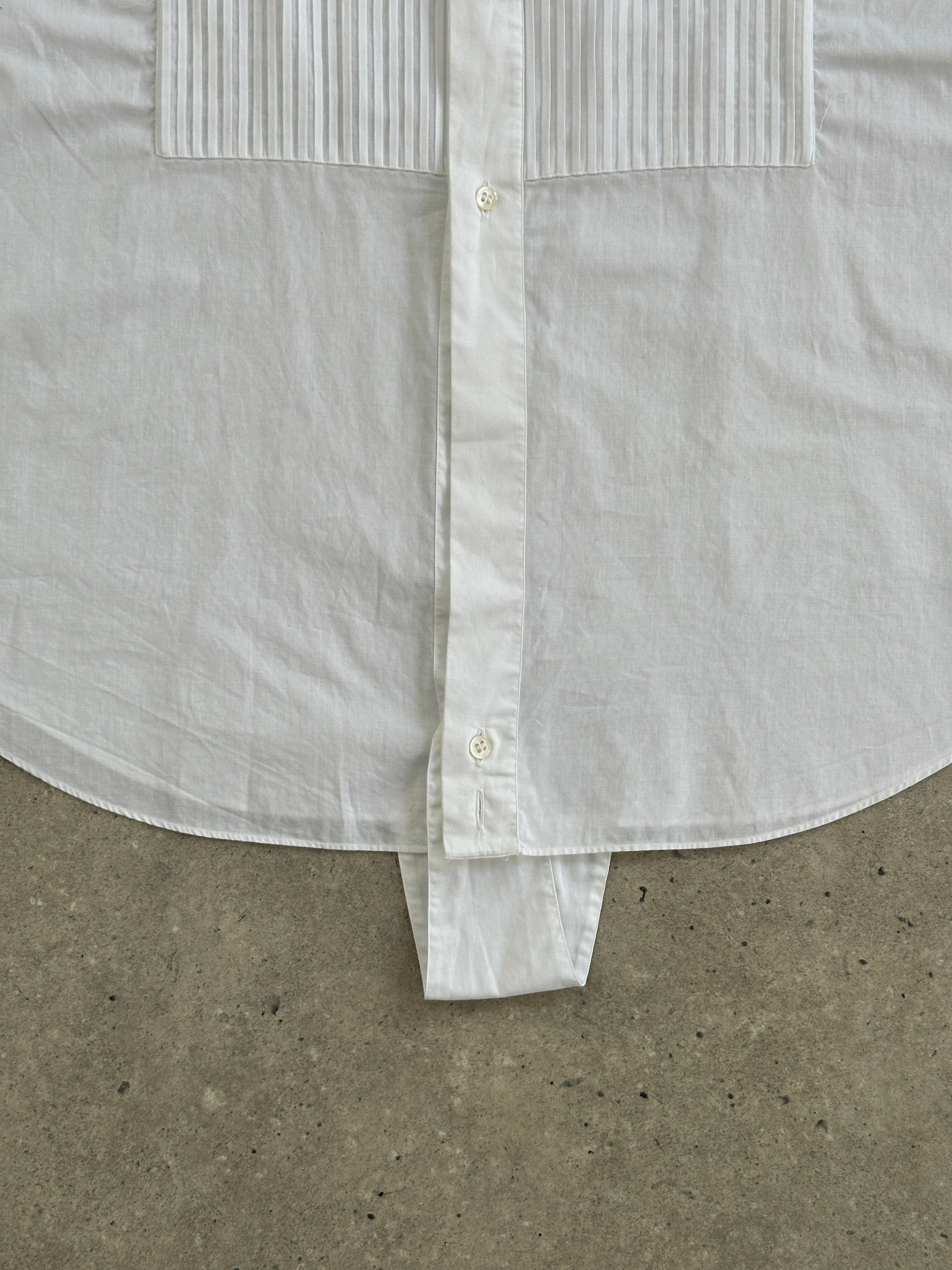 Vintage wing collar tuxedo dress shirt, size large, featuring classic design with crisp white fabric and formal front buttons.