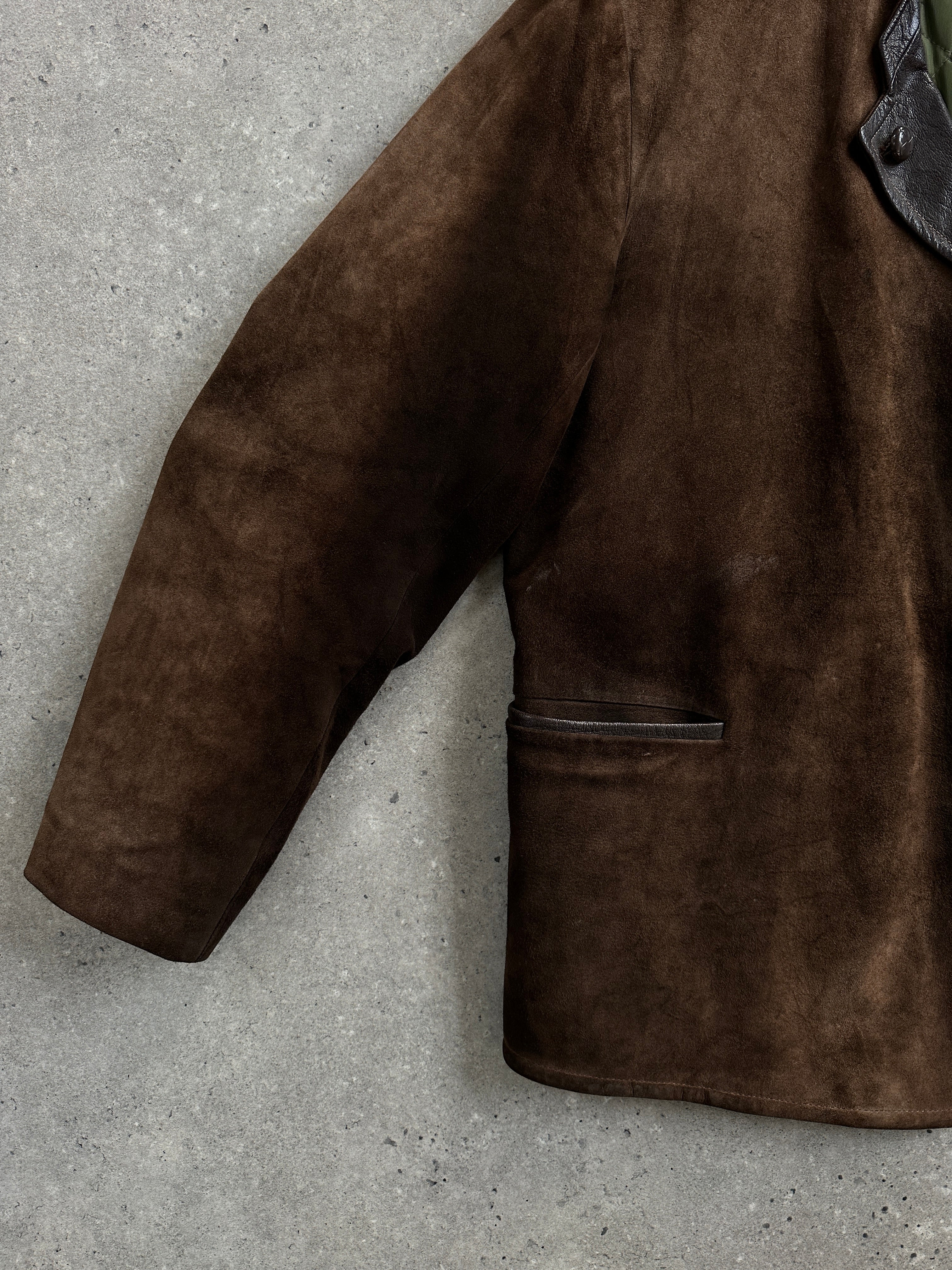 Vintage 1970s suede leather jacket in XL, featuring classic design and rich texture, displayed on a hanger.