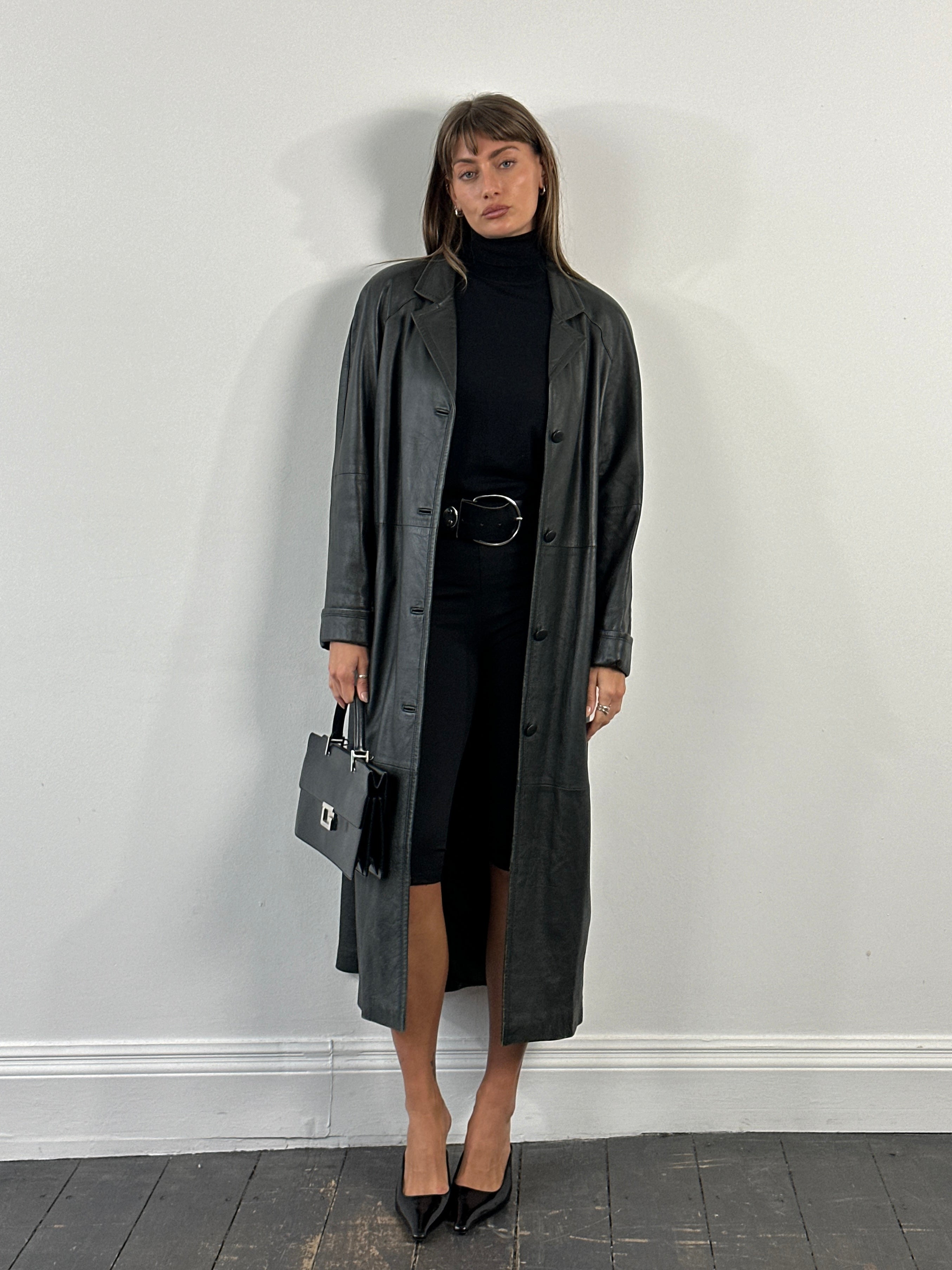Vintage 1990s leather trench coat, floor length jacket in size large, showcasing classic vintage style and rich leather texture.